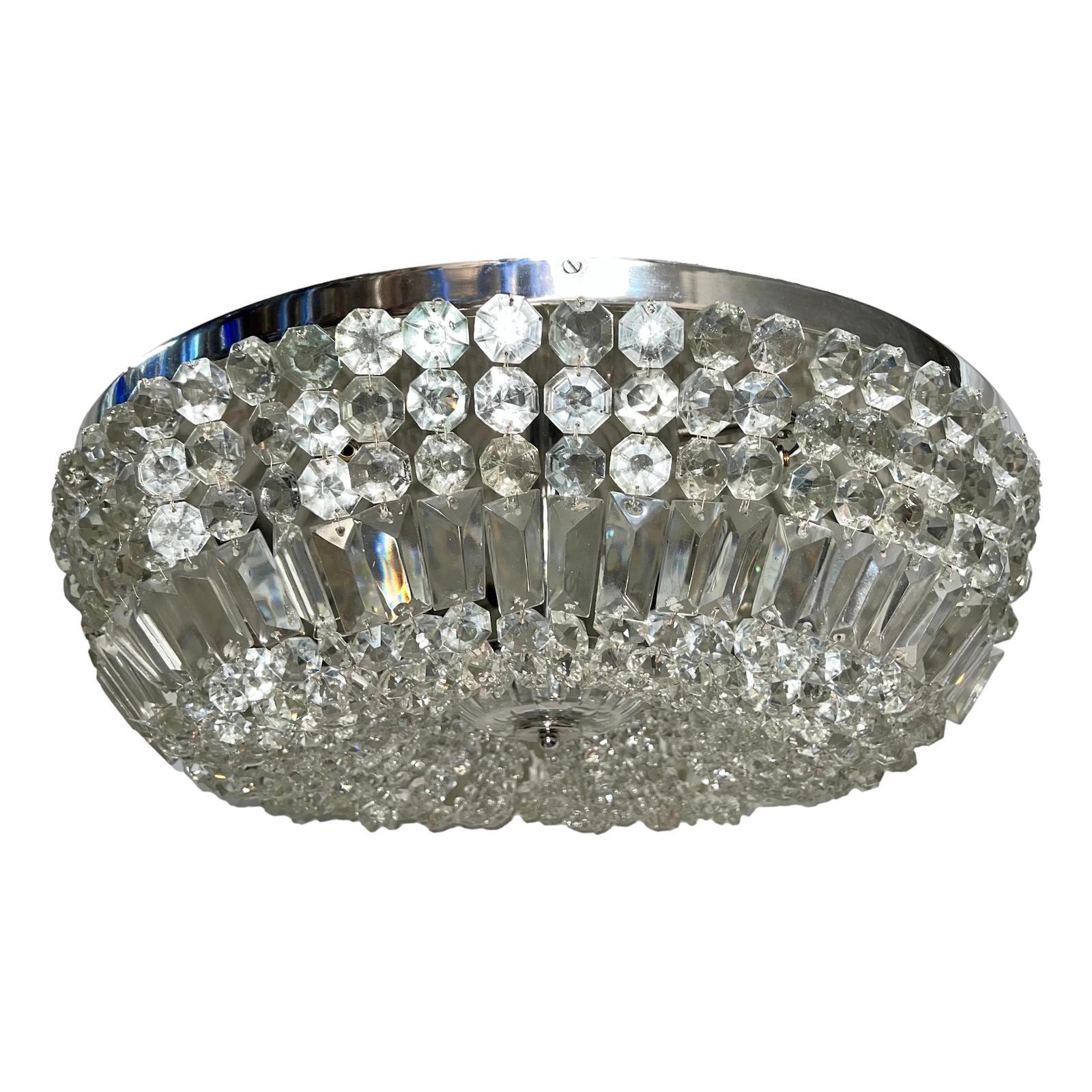A set of four nickel-plated Art Deco crystal French flush mounted light fixtures with six lights each. Sold individually.

Measurements:
Diameter: 23