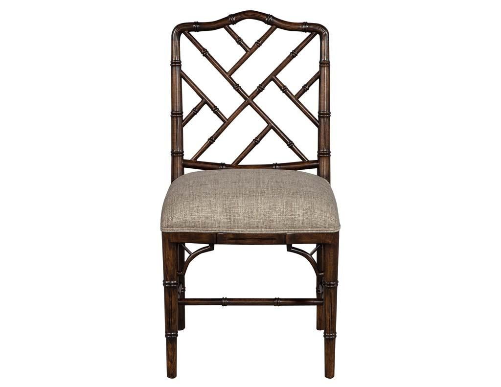 This set of 8 Carrocel custom chantilly beechwood dining chairs accentuate the Asian Chippendale faux bamboo style. This set is custom finished in a luxurious deep walnut stain and upholstered by Carrocel. Designed with an open camel back