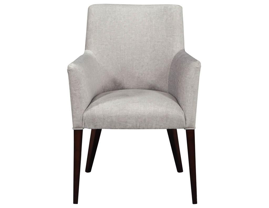 Set of 8 custom modern dining chairs by Carrocel. These sleek chairs have an Italian modernism with a fine cut elegant detailed design. Upholstered by our craftsmen in a designer fabric and finished in a hand rubbed espresso walnut.

Price