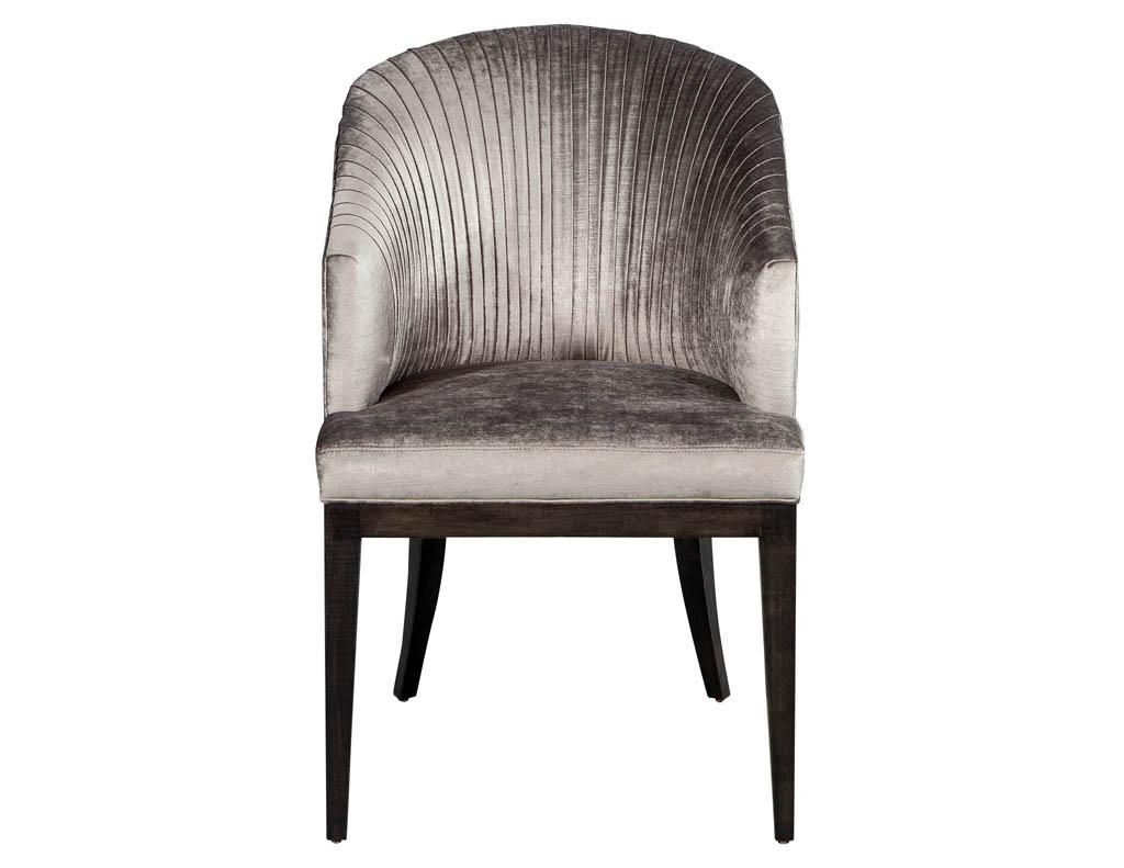 Exclusive Carrocel custom plisada chair. 
This set of 8 pleated dining chairs feature a velvet deep grey fabric and dark stain finished wood legs.
Also available COM.