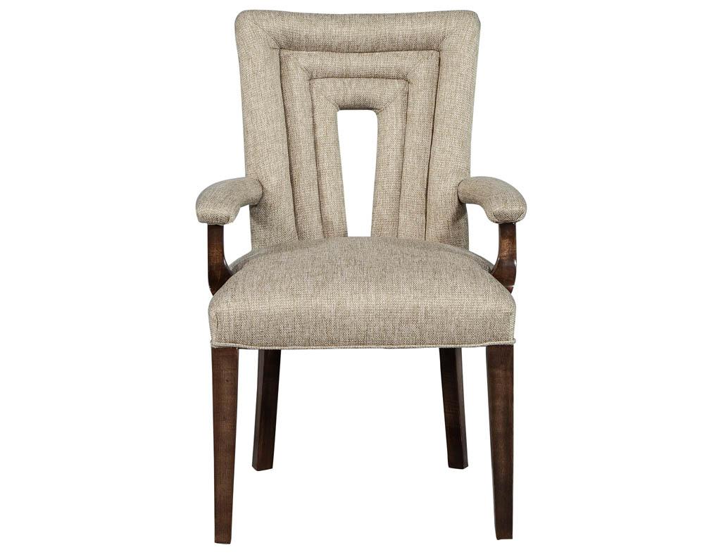 This set of 8 Hilgard dining chairs are a new addition to the Carrocel custom collection. They have a Modern style with a Classic tubular surrounded back. They are elegantly upholstered in a linen and finished in medium walnut stain. These chairs