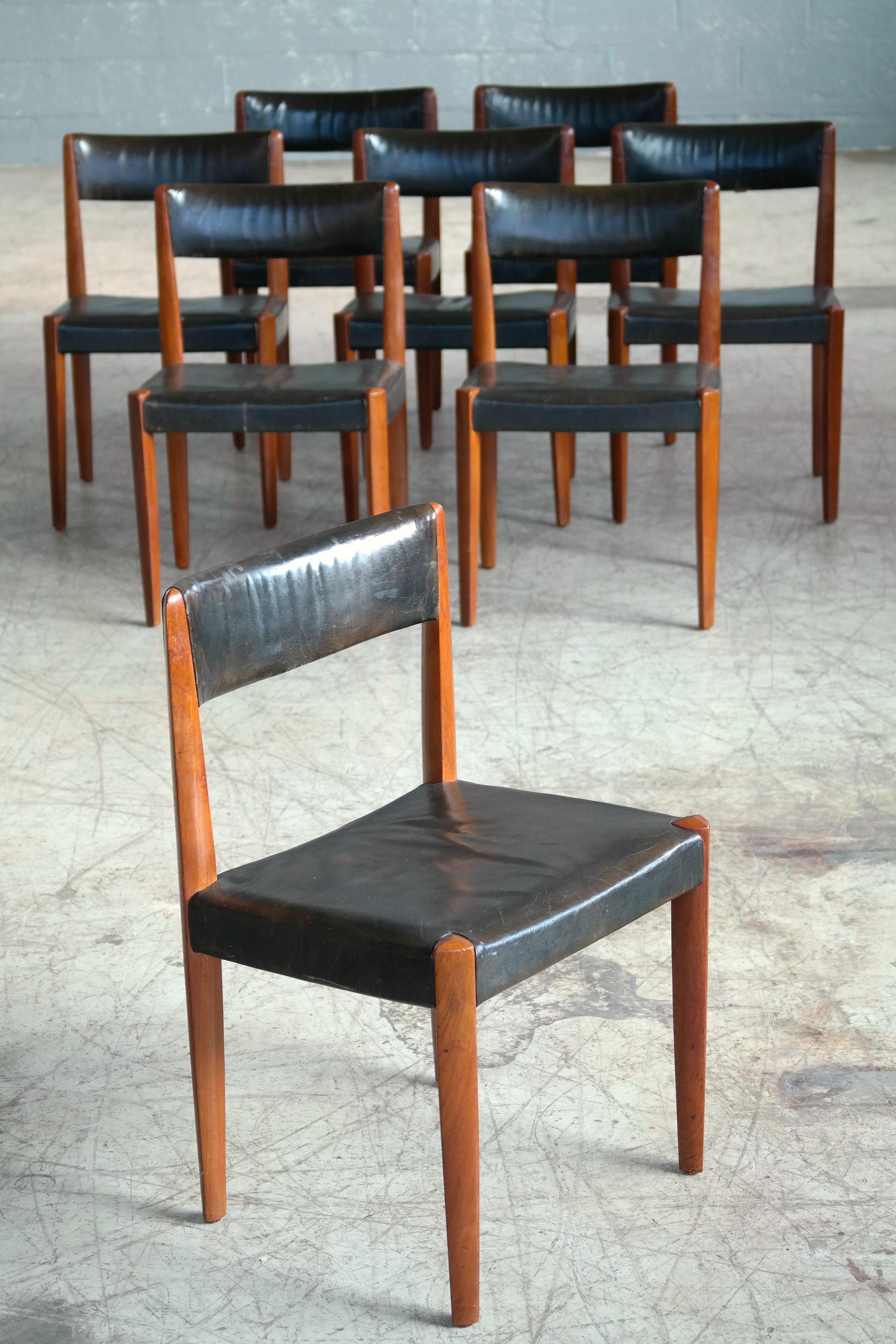 Beautiful and rare set of 8 dining chairs designed by Aage Schmidt Christensen and manufactured by Fritz Hansen as Model # 4112 in the 1950's. Solid carved teak teak with patent leather. The frames show beautiful angles and great color and patina.
