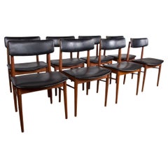 Set of 8 Danish chairs in Teak, black leatherette and brass, Sven Chrobat/Sax.