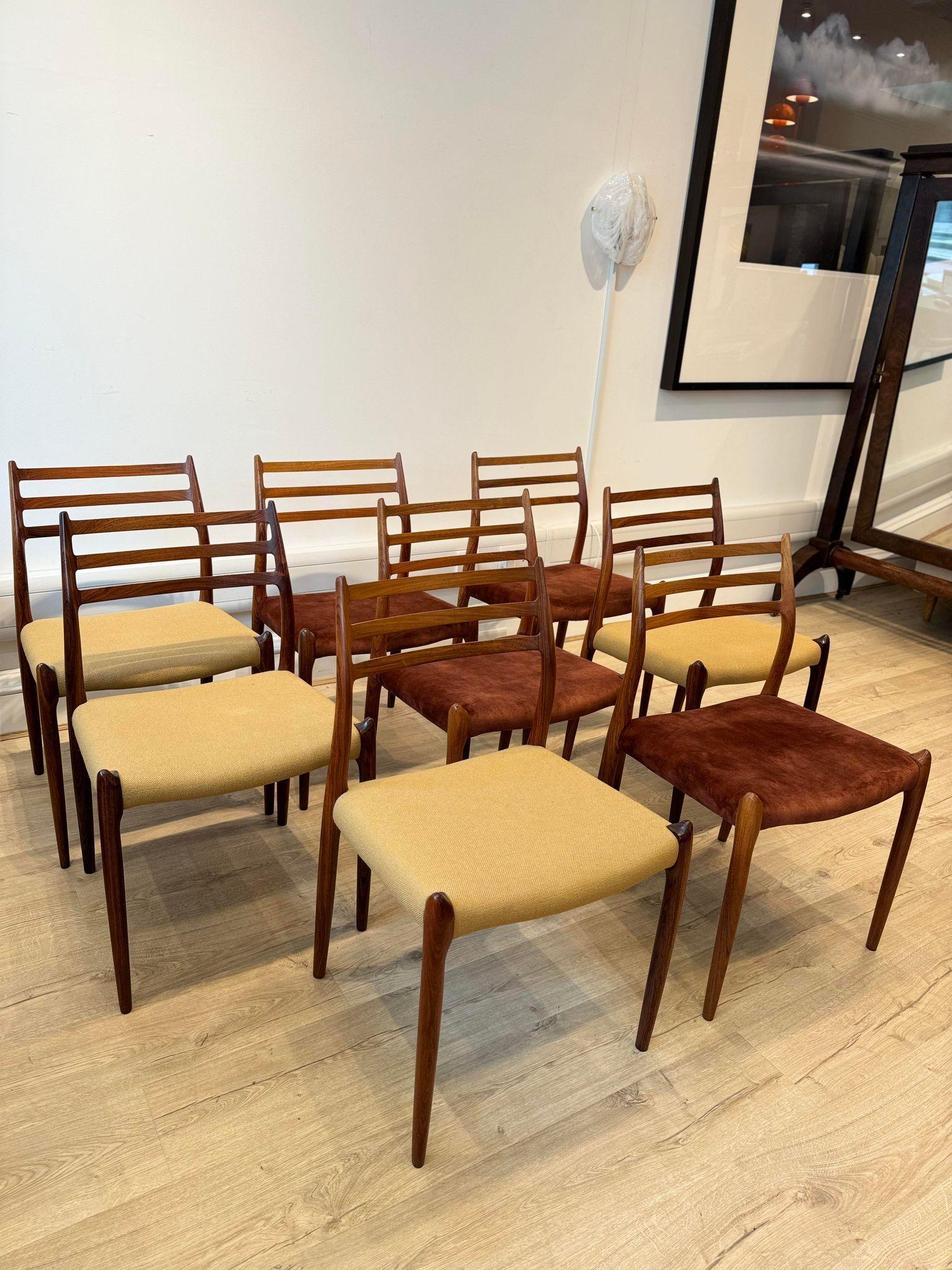 Set Of 8 Danish Dining Chairs, designed in the 1950s by Niels Otto Møller. Produced by J. L. Møller Møbelfabrik.

These chairs feature beautiful Rosewood frames, this set has two different upholstery - 4 being in a woven hopsack and 4 being in