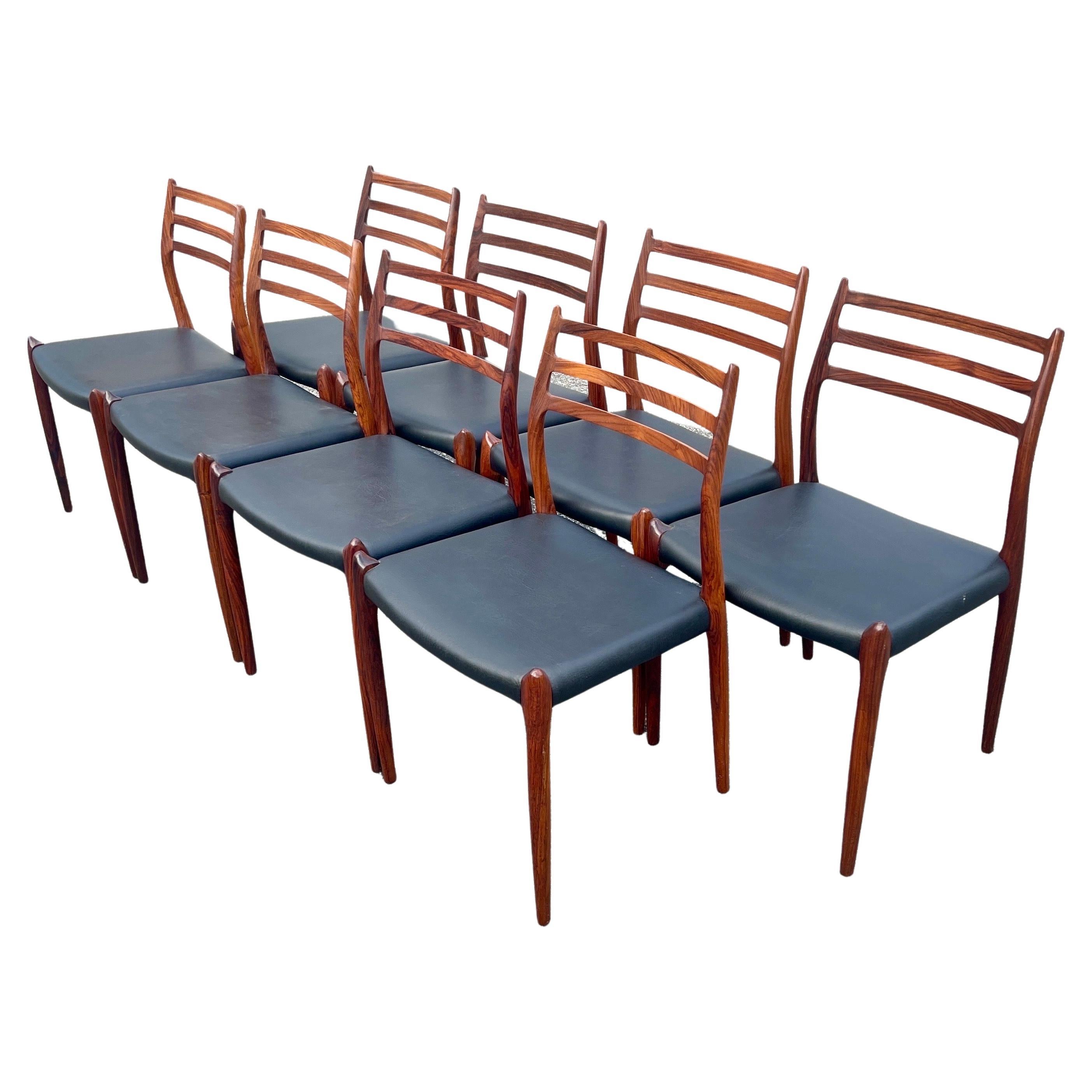 Experience the beauty and craftsmanship of mid-century design with this set of 8 Niels Moller Model 78 rosewood side chairs. Produced by JL Moller, these chairs are the most sought-after of their kind, featuring a distinctive and attractive design