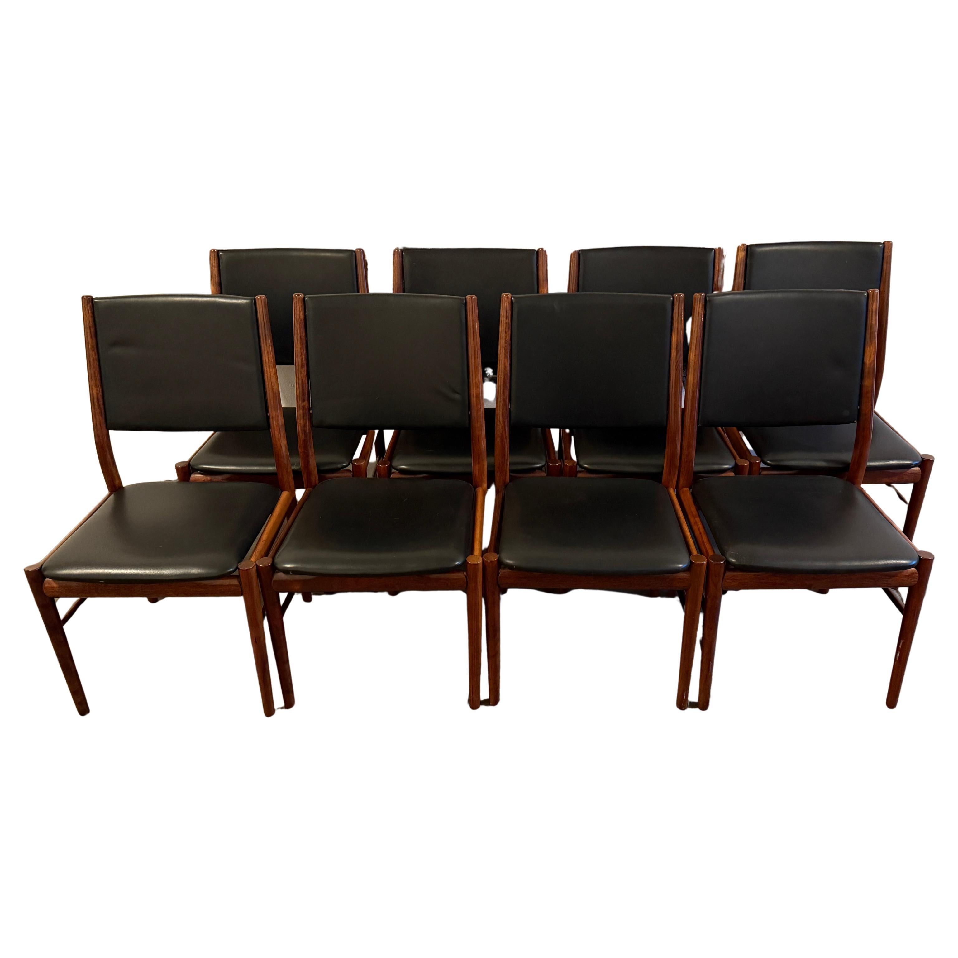 Set of 8 danish modern black leather rosewood dining chairs. Very high quality set of Scandinavian modern dining chairs. Nice black leather dining chairs with solid rosewood frames. Made in Denmark. Located in Brooklyn NYC.

Being sold as a set of