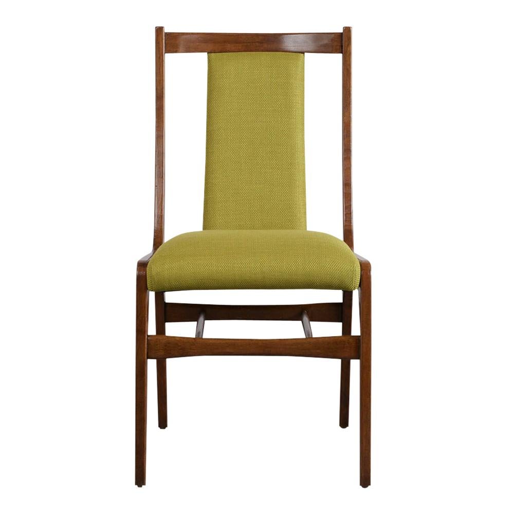 Set of eight comfortable 1960s Danish style curved back dining chairs feature completely restored wood frames, with original rich walnut color and lacquered finish. They've have been professionally reupholstered in a light olive color fabric. These
