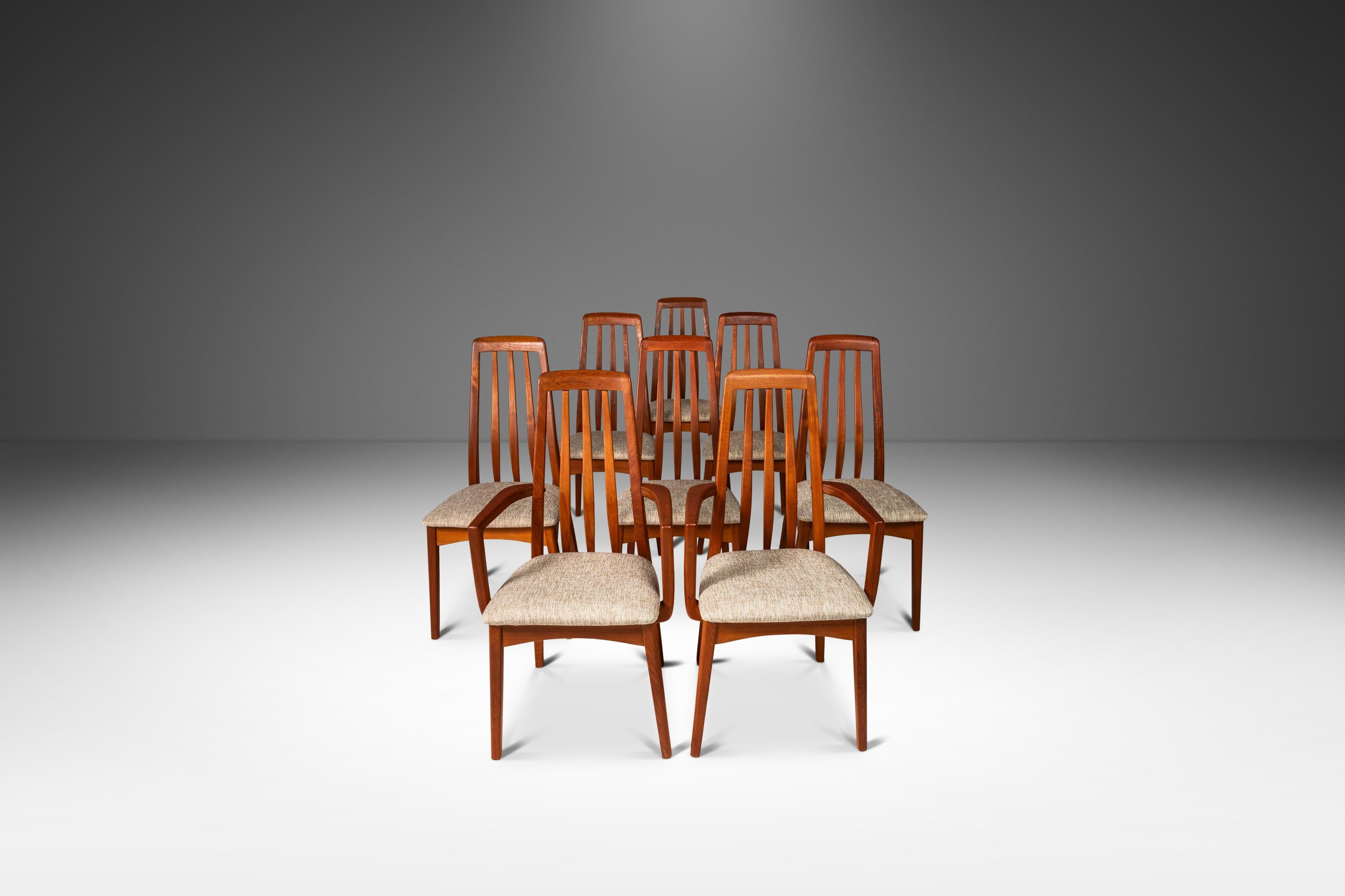  Introducing an expansive set of eight beautifully sculpted Danish Modern teak dining chairs designed by Benny Linden for Benny Linden Design. These superbly crafted and sculpted modern teak dining chairs with curved backrests feature new medium