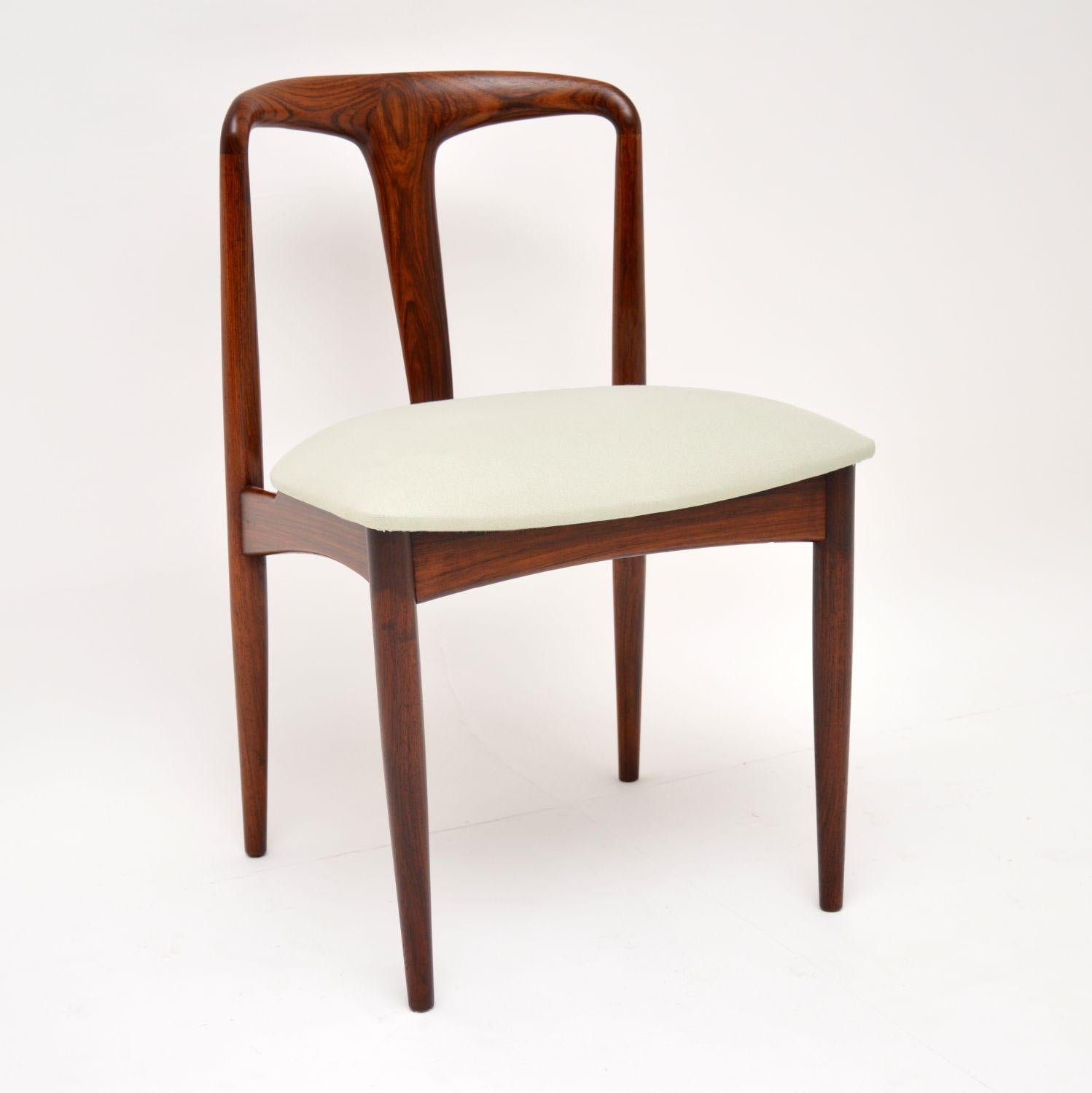A stunning set of top quality vintage Danish dining chairs in rosewood. This model is called the Julianne chair, they were designed by Johannes Andersen and made by Uldum Møbelfabrik. They date from the 1960s, they are all in superb fully restored