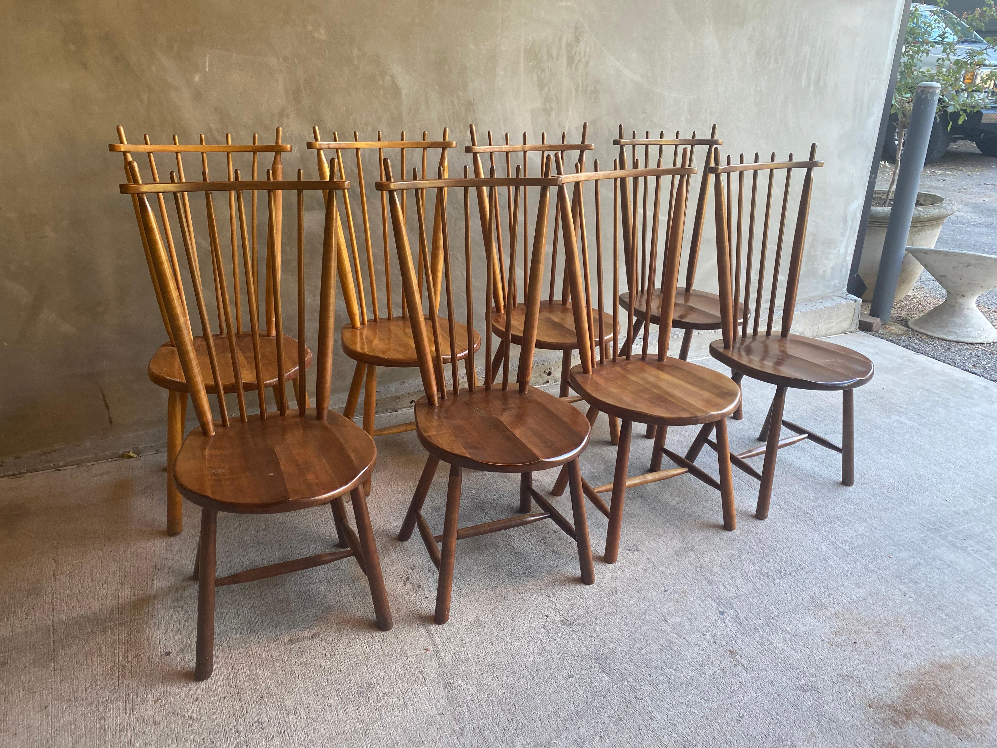 Dutch dining chairs constructed of solid hardwood in a rich range of cognac to brown reflect the mid-century interpretation of a Windsor chair.  Curved seat and spindle back with just the right slant make a very comfortable dining chair.  By De Ster