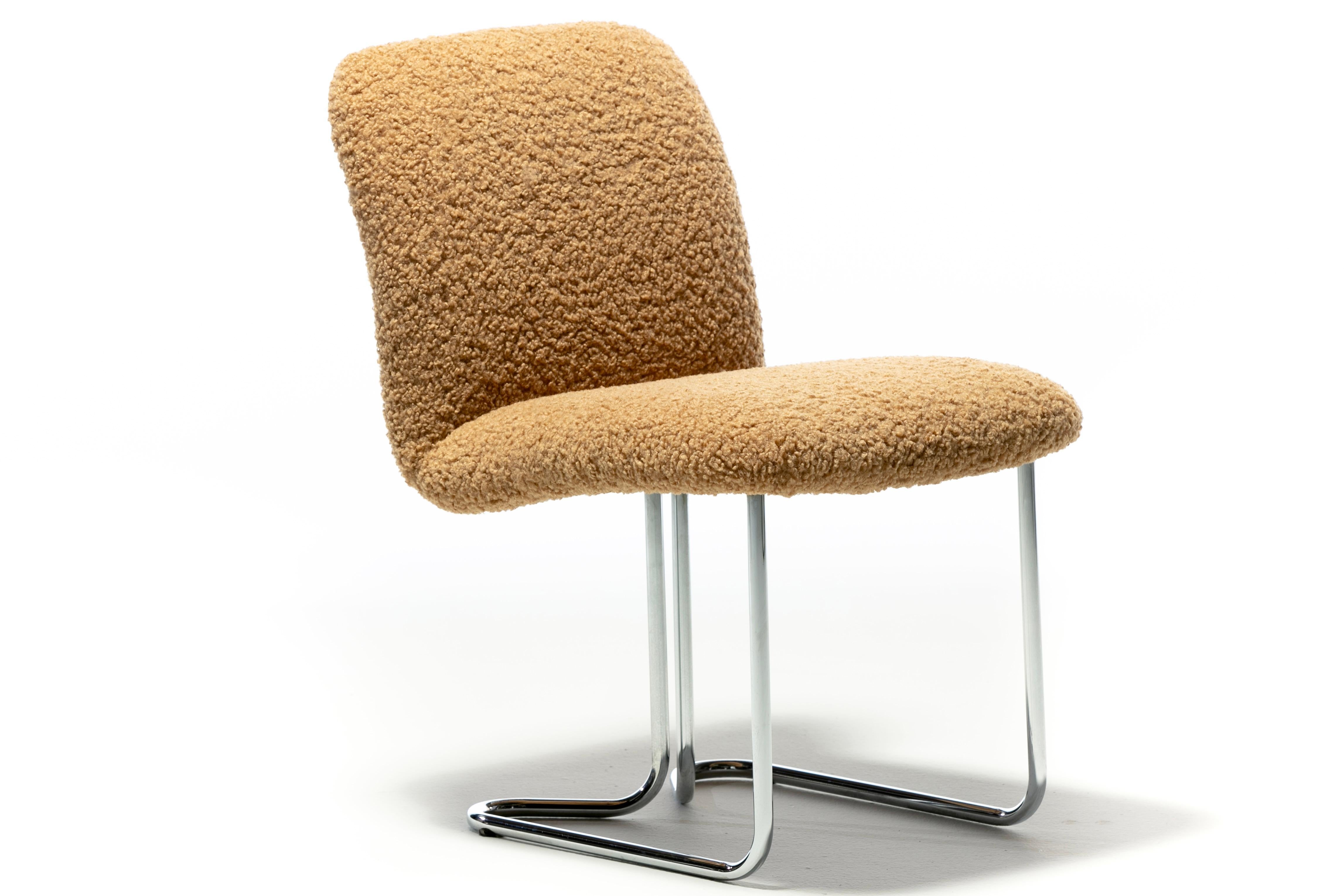 Super sultry and sleek set of eight 1970s dining chairs produced by Design Institute of America featuring cantilever bent chrome legs. Newly upholstered in modern and luxurious camel bouclé. The overall look is modern with a fresh and sleek vibe.