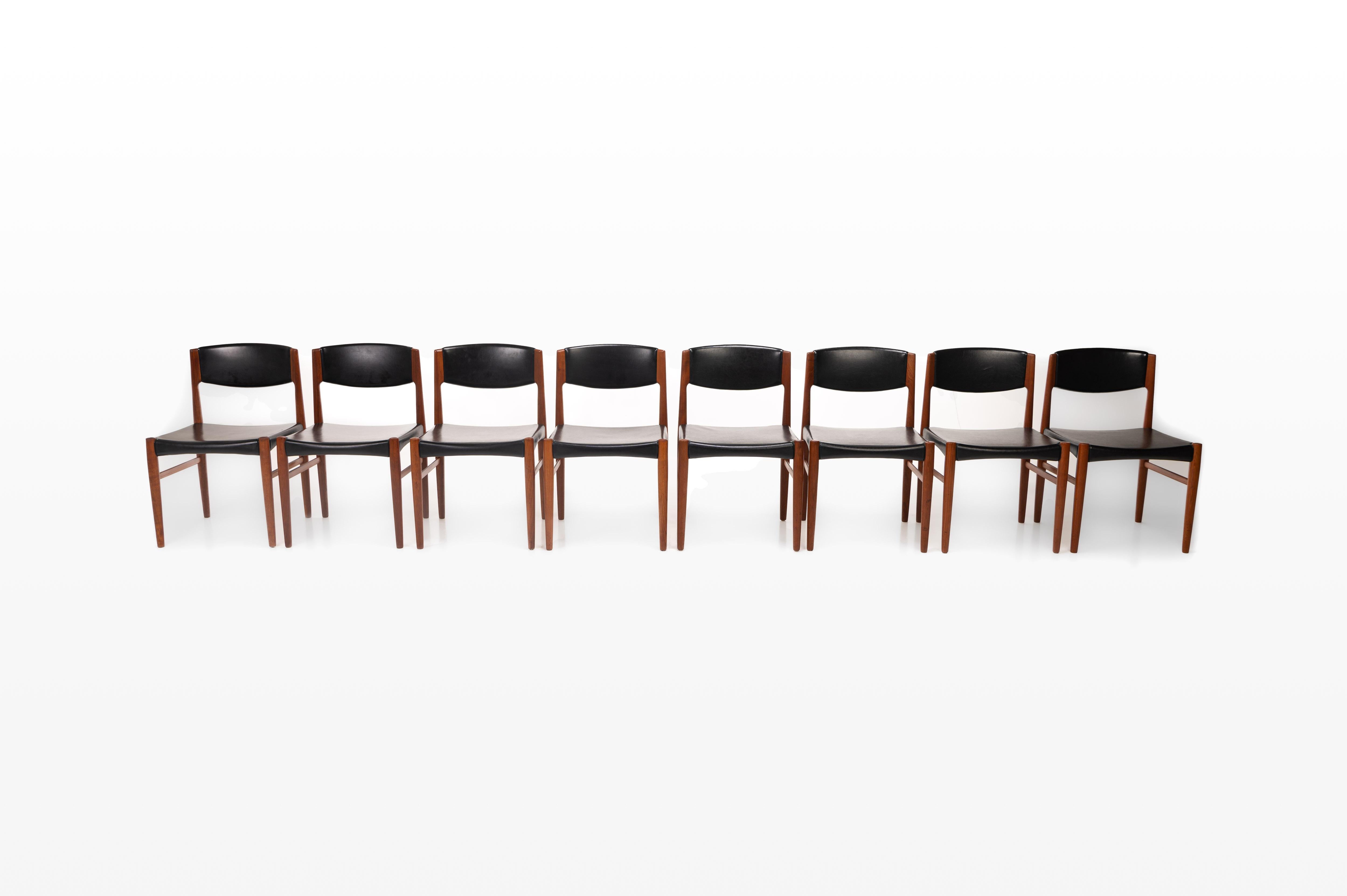 Very nice set of eight Danish vintage dining chairs produced by Grete Jalk Glostrup Møbelfabrik in the 60s. The chairs have a teak frame and black seats.
 
