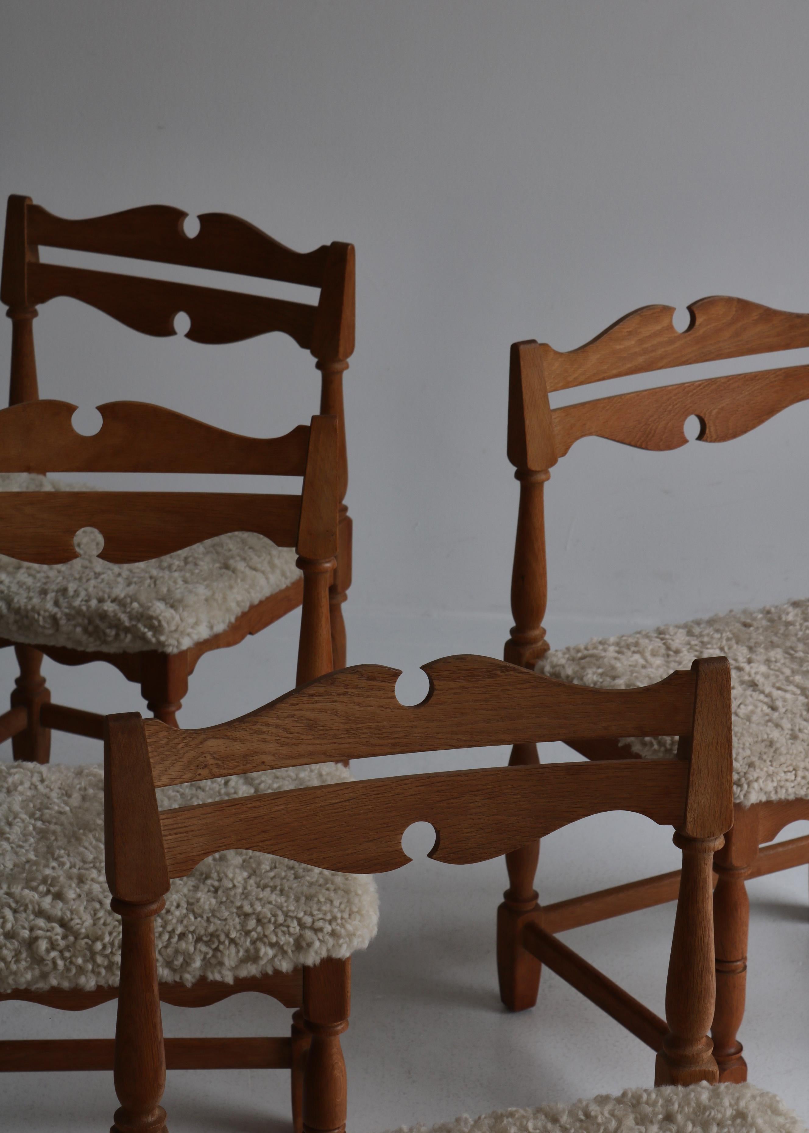 Set of 8 Dining Chairs by Henry Kjærnulf, Sheepskin & Oak, Denmark In Fair Condition In Odense, DK