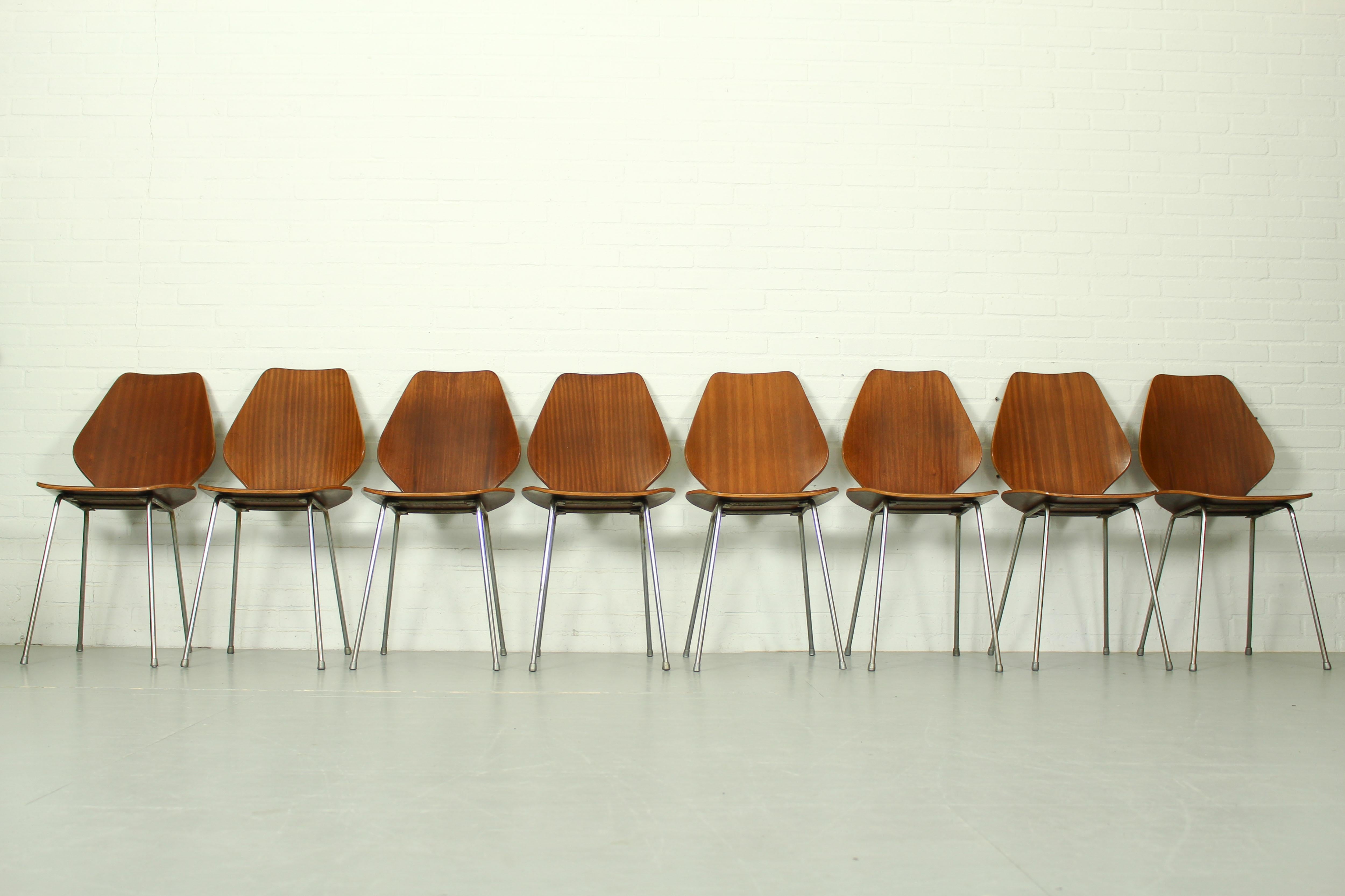 Rare set of 8 Butterly chairs by Herbert Hirche for Jofa Stalmöbler, 50s Denmark. Made of thick plywood with teak veneer. The legs are made of chromed steel. Great color / patina, some professional repairs in the teak veneer as depicted on the