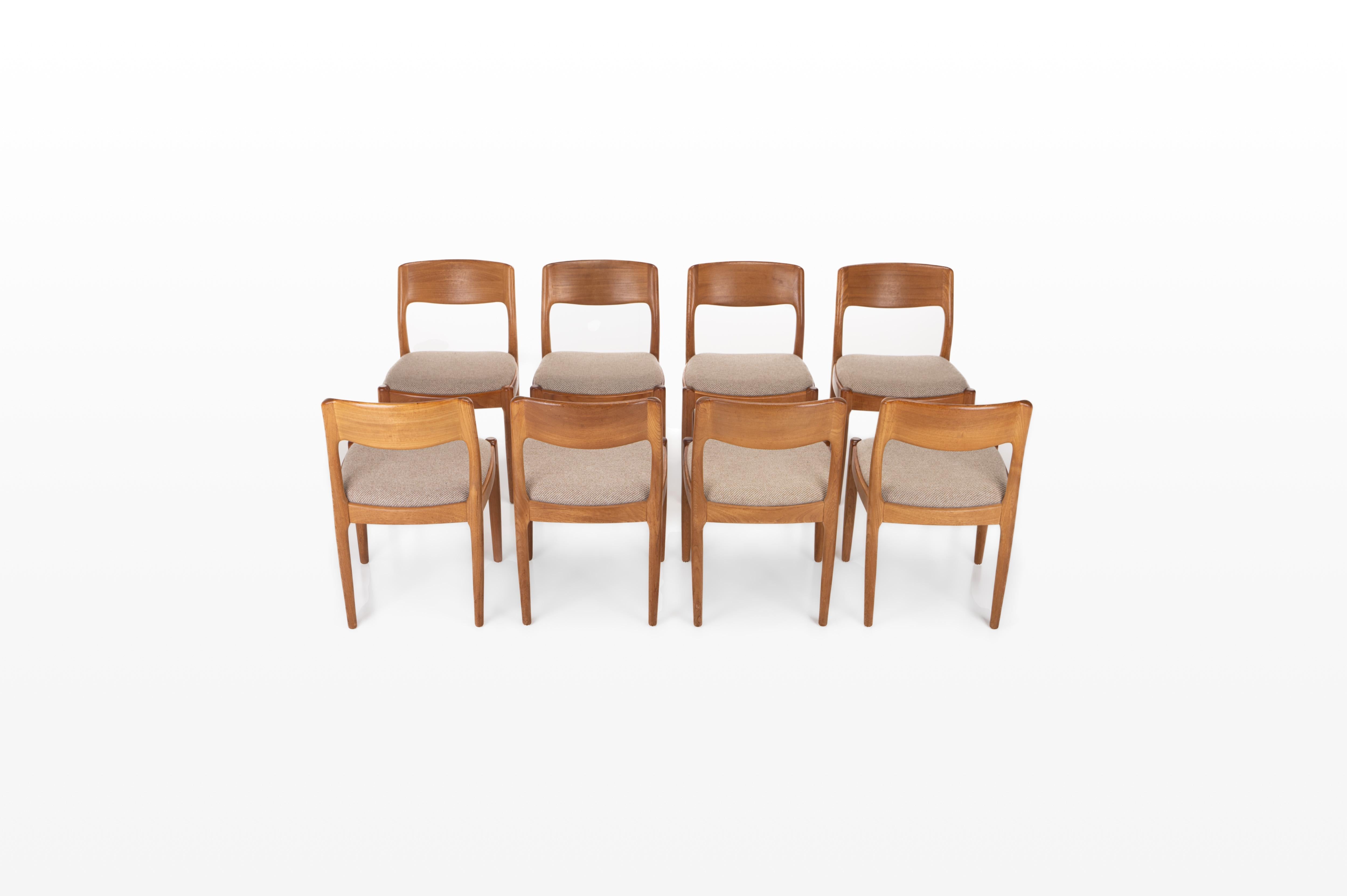 Set of eight teak dining chairs designed by Juul Kristensen for JK Denmark. Beautifully designed teak frame with a cream beige upholstery.
