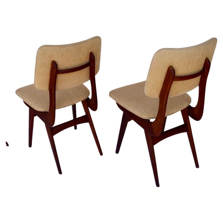 *Price includes restoration to the wood and labour for new upholstery. 

This is a very rare set of 8 dining chairs by Louis van Teeffelen in Afrormosia,
also known as African teak. These chairs have amazing sculpted frames and with the right fabric