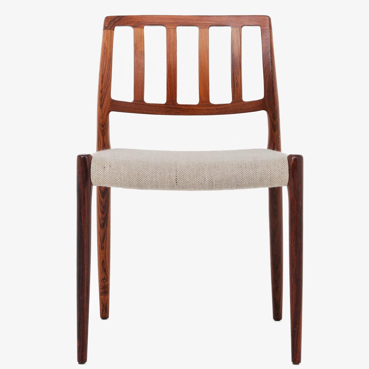 NO 83 - Set of 8 dining chairs in rosewood and seat in light wool. Niels O. Møller / J. L. Møller.