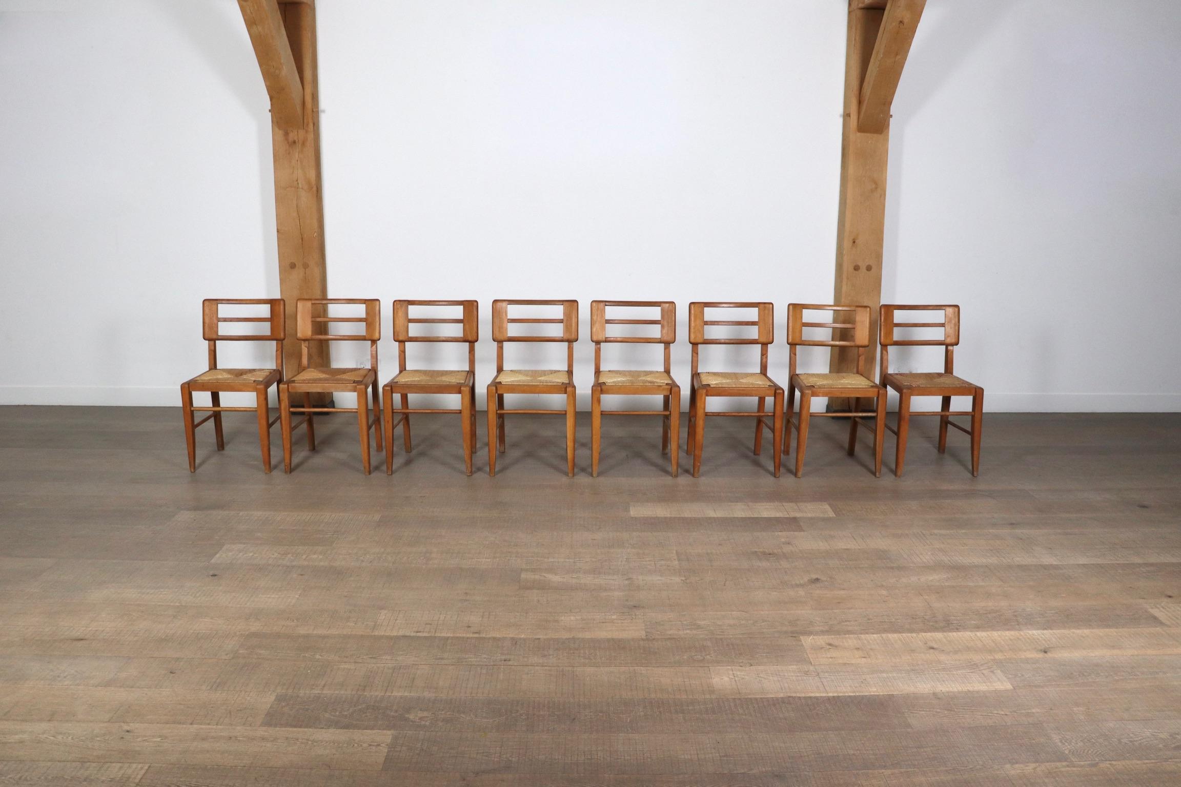 Indulge in the timeless elegance of French craftsmanship with this exquisite set of eight dining chairs by French designer and architect Pierre Cruège (1913-2003), crafted in oak and straw in the 1950s.

Cruège’s fusion of modernist principles with
