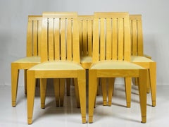 Set of 8 Dining Chairs in Blonde Wood and Leather Upholstery.