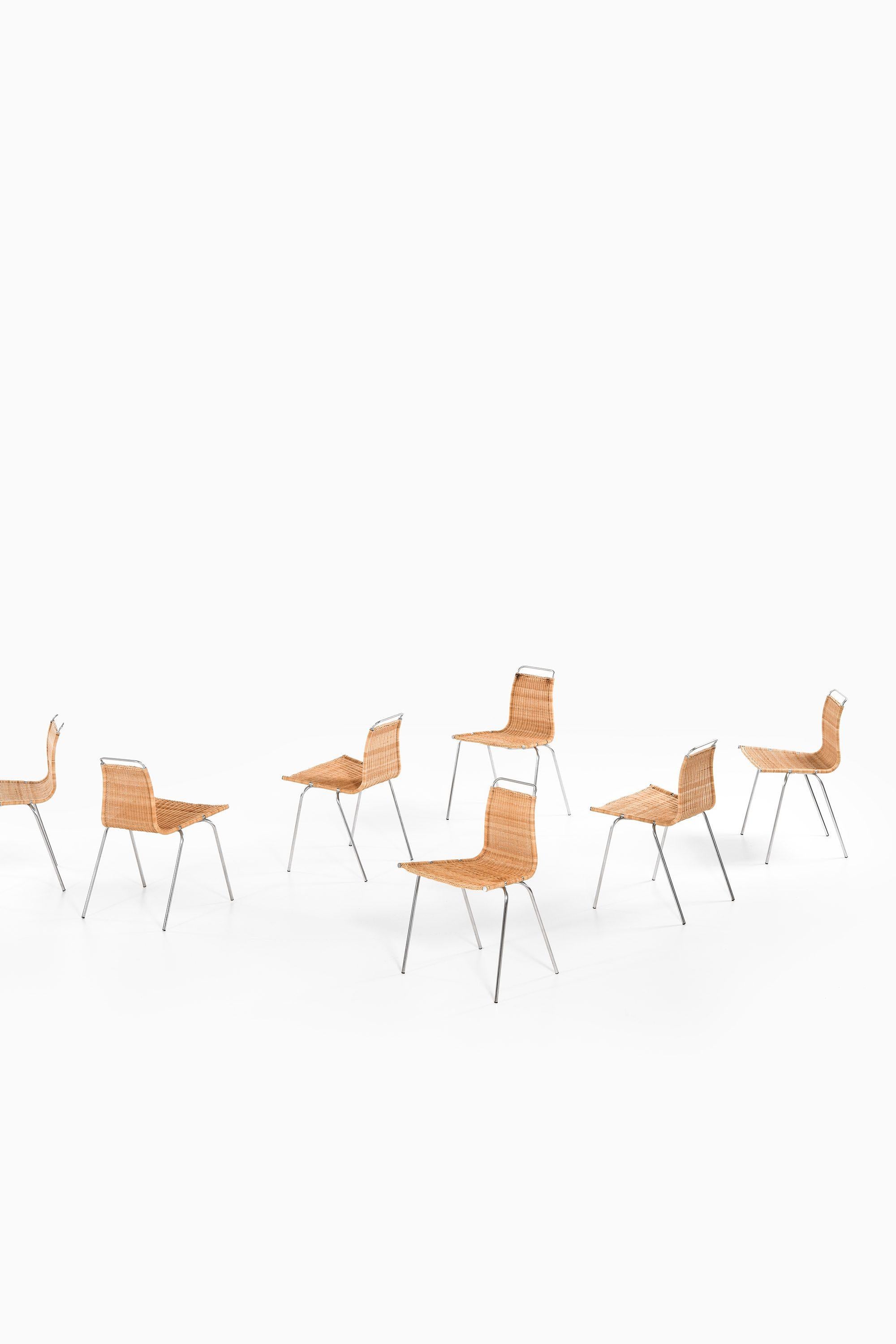 Set of 8 Dining Chairs in Chromed Steel and Woven Cane by Poul Kjærholm, 1950's In Good Condition For Sale In Limhamn, Skåne län