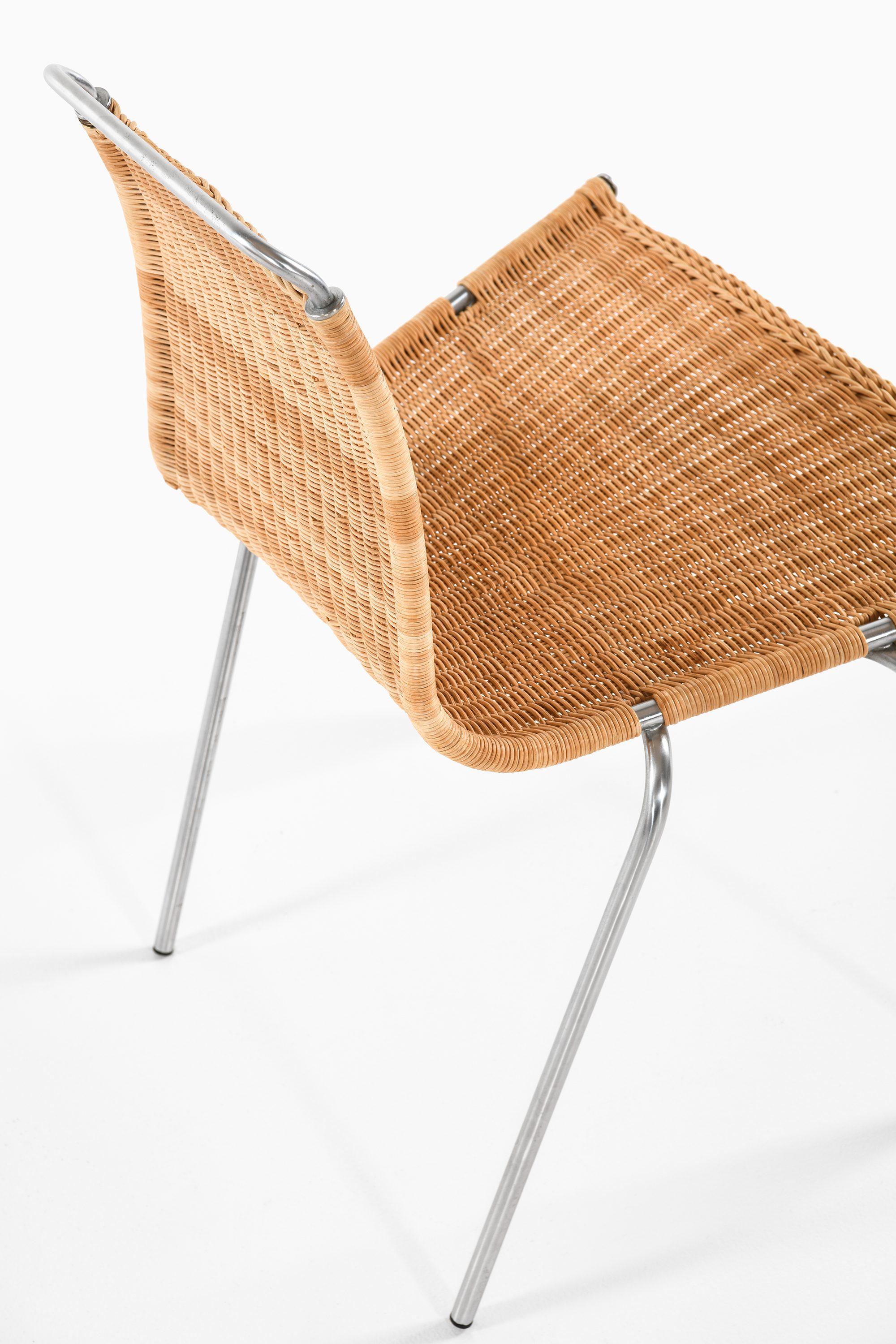 Set of 8 Dining Chairs in Chromed Steel and Woven Cane by Poul Kjærholm, 1950's For Sale 1