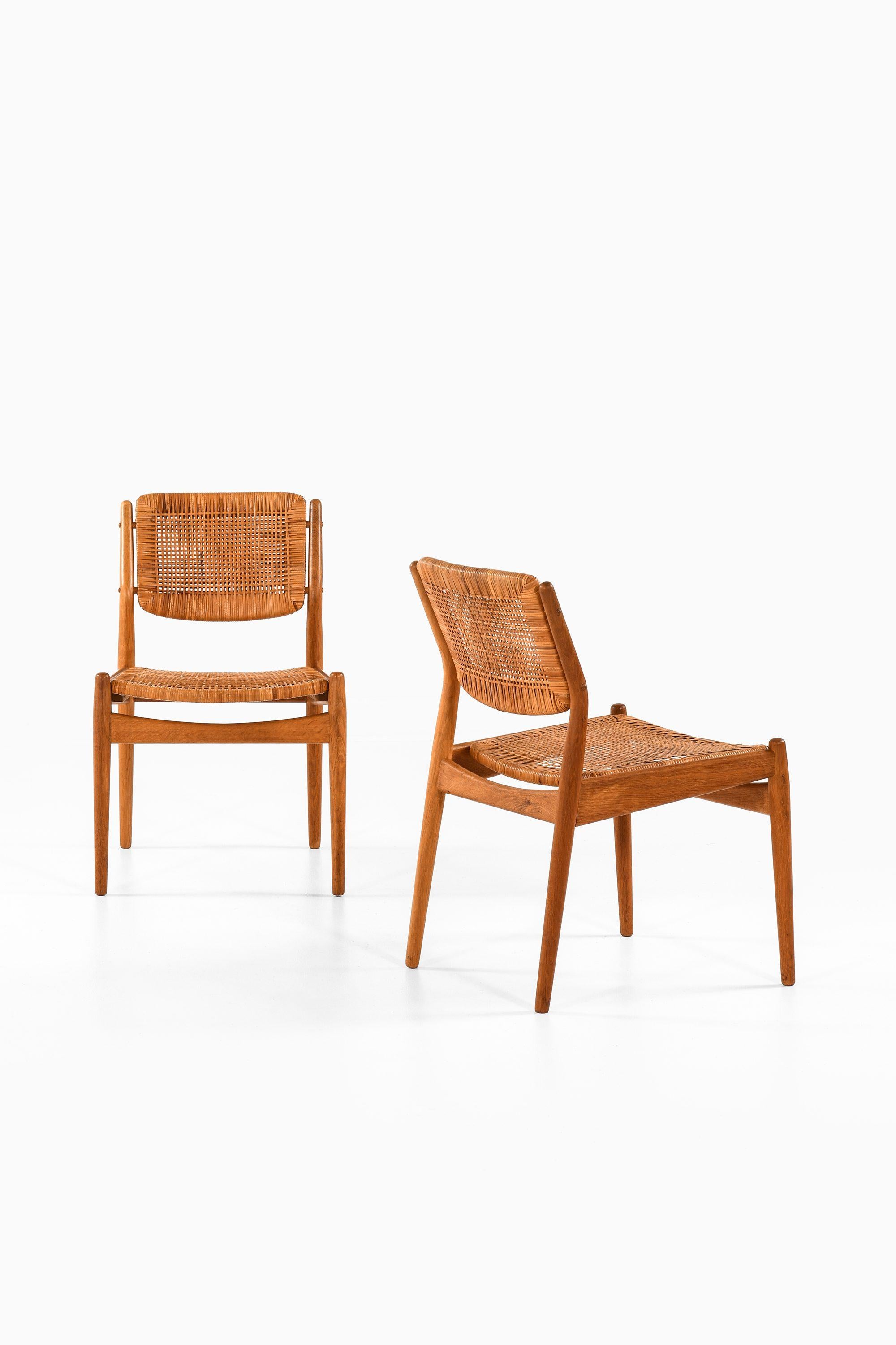 Set of 8 Dining Chairs in Oak and Woven Cane by Arne Vodder, 1951

Additional Information:
Material: Oak and woven cane
Style: Mid century, Scandinavian
Rare set of 8 dining chairs model 51
Produced by Sibast møbelfabrik in Denmark
Dimensions (W x D