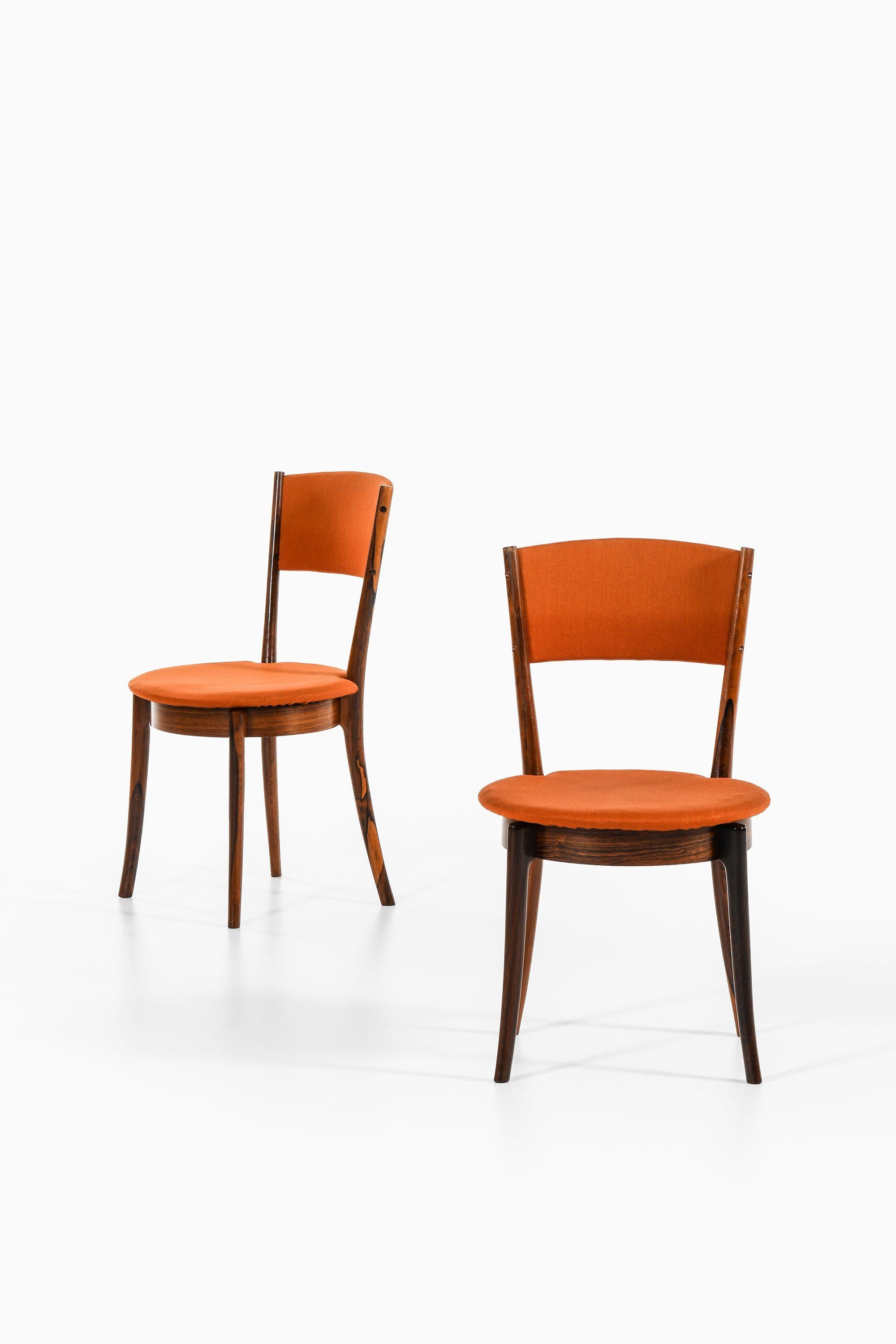 Mid-Century moderno Set di 8 sedie da pranzo in legno di palissandro e tessuto originale, anni '60 in vendita
