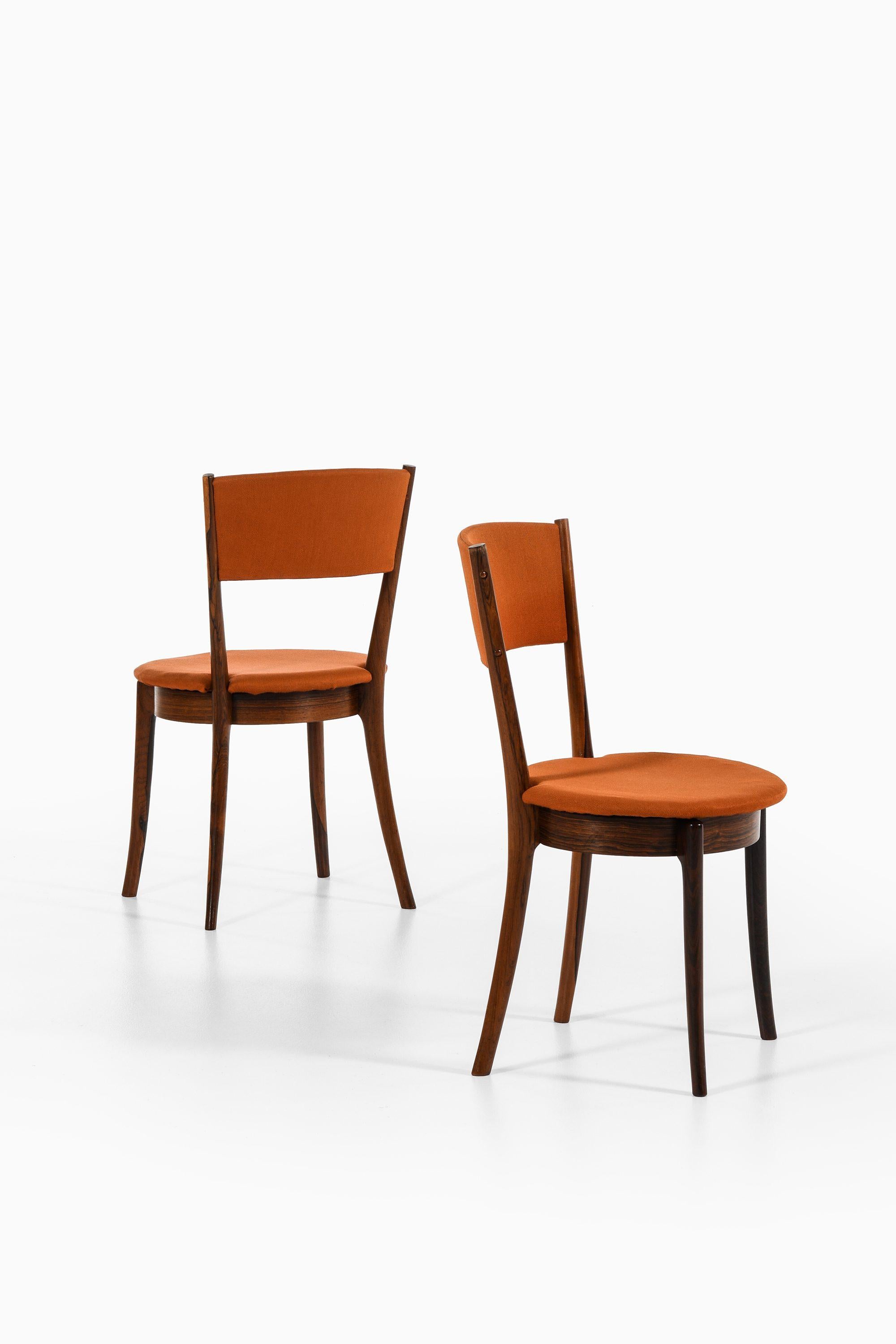 Danese Set di 8 sedie da pranzo in legno di palissandro e tessuto originale, anni '60 in vendita