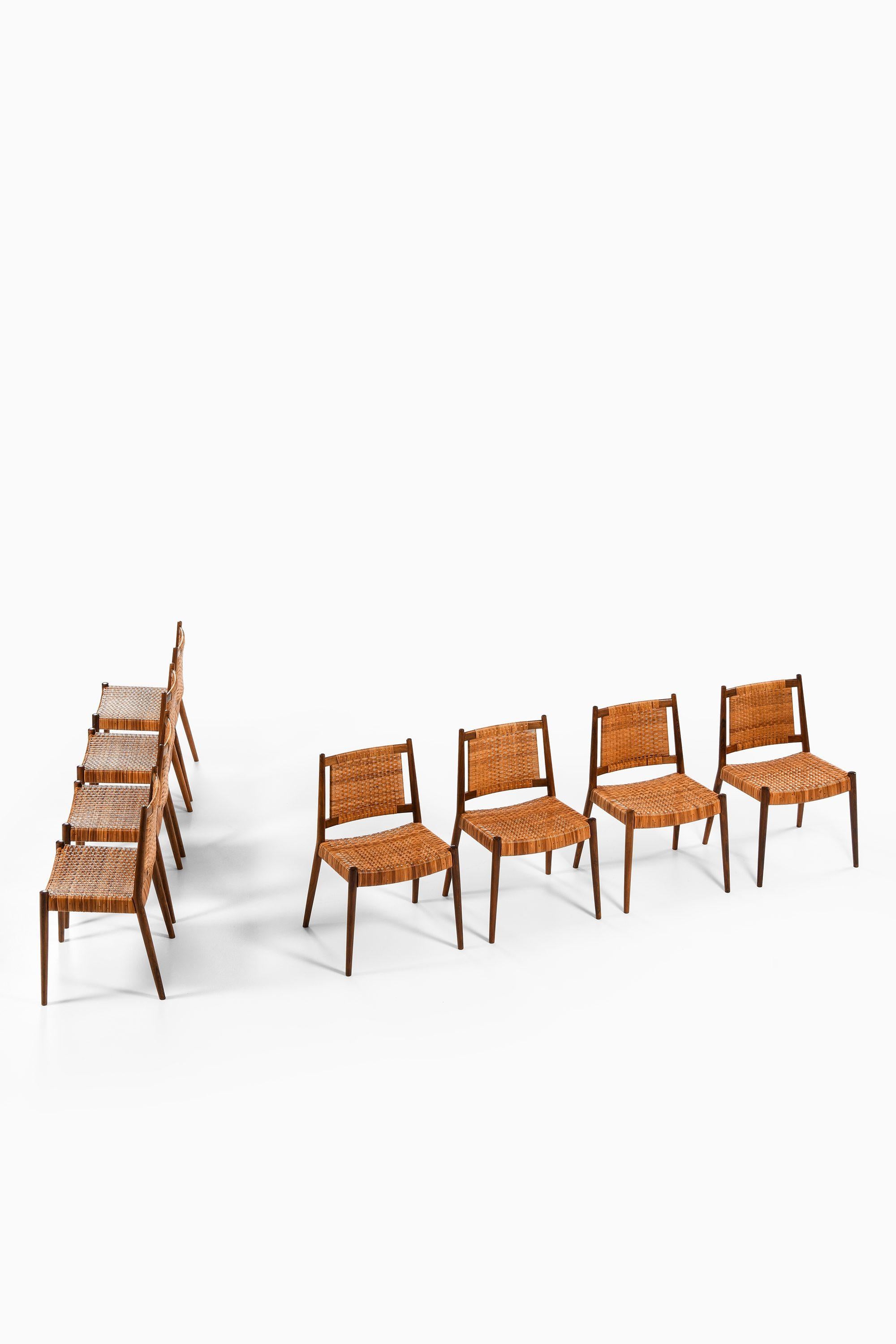 Set of 8 Dining Chairs in Solid Rosewood and Woven Cane by Steffan Syrach-Larsen, 1960

Additional Information:
Material: Solid rosewood and woven cane
Style: Mid century, Scandinavia
Produced by cabinetmaker Gustav Bertelsen in Denmark
Dimensions