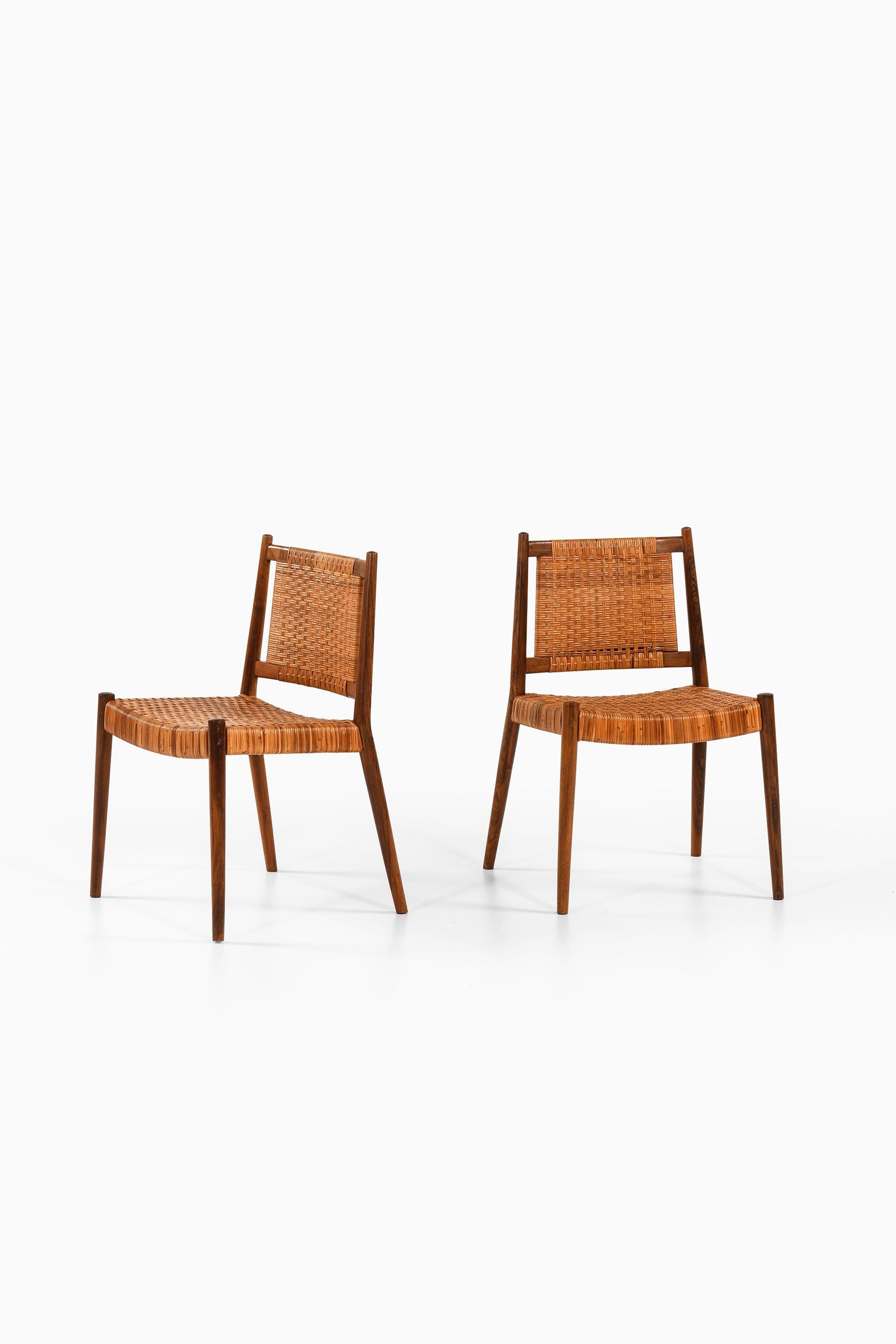 Danois Ensemble de 8 chaises de salle à manger en bois de rose et canne tissée de Steffan Syrach-Larsen, 1960 en vente