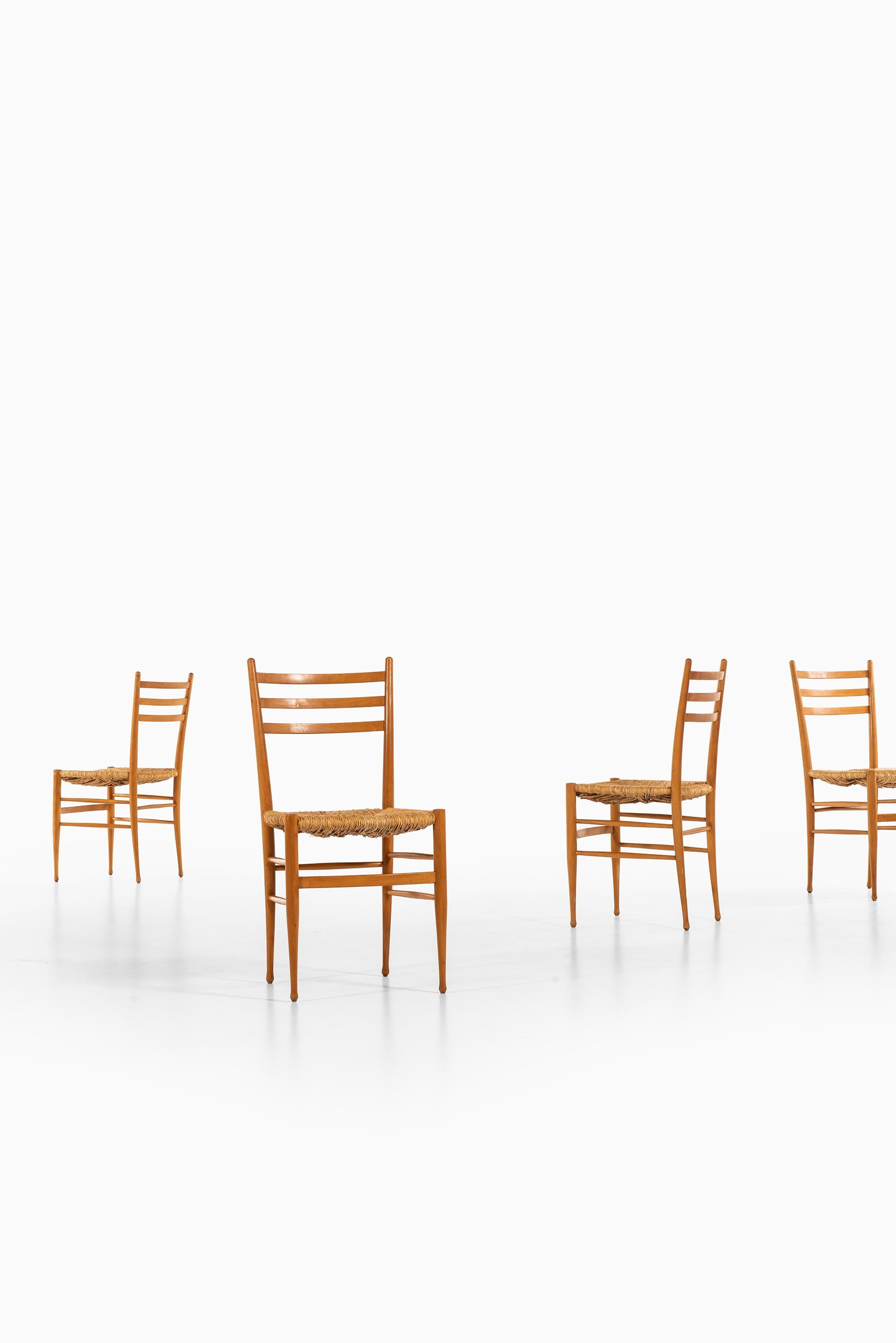 Set of 8 dining chairs produced in Italy.