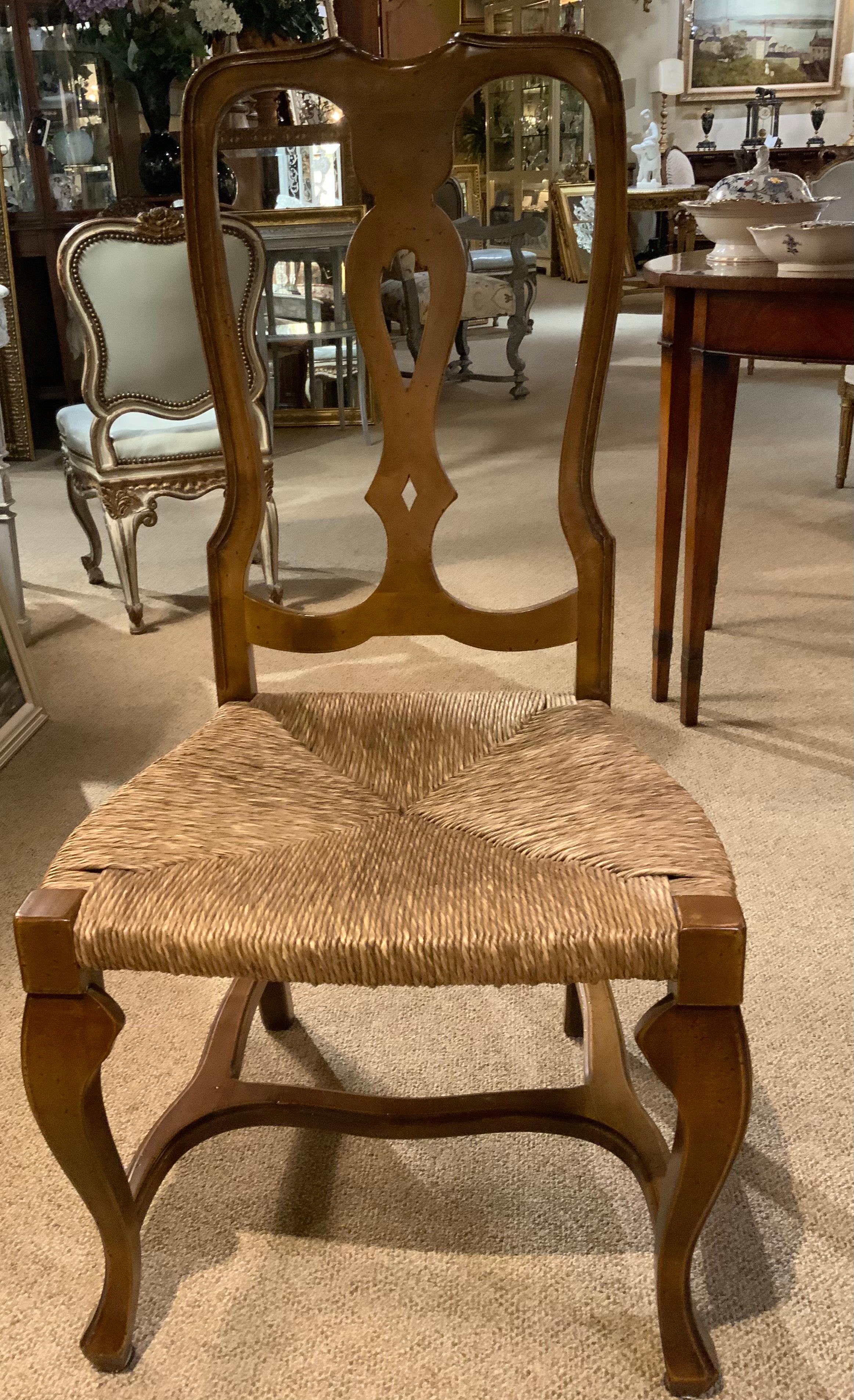 These are both handsome and extremely sturdy. They
Are comfortable with high backs. The color of the wood
Is a burnished honey color. The seats are in great condition 
With rush that is a fine color.  They have stretchers below
Connecting the legs.