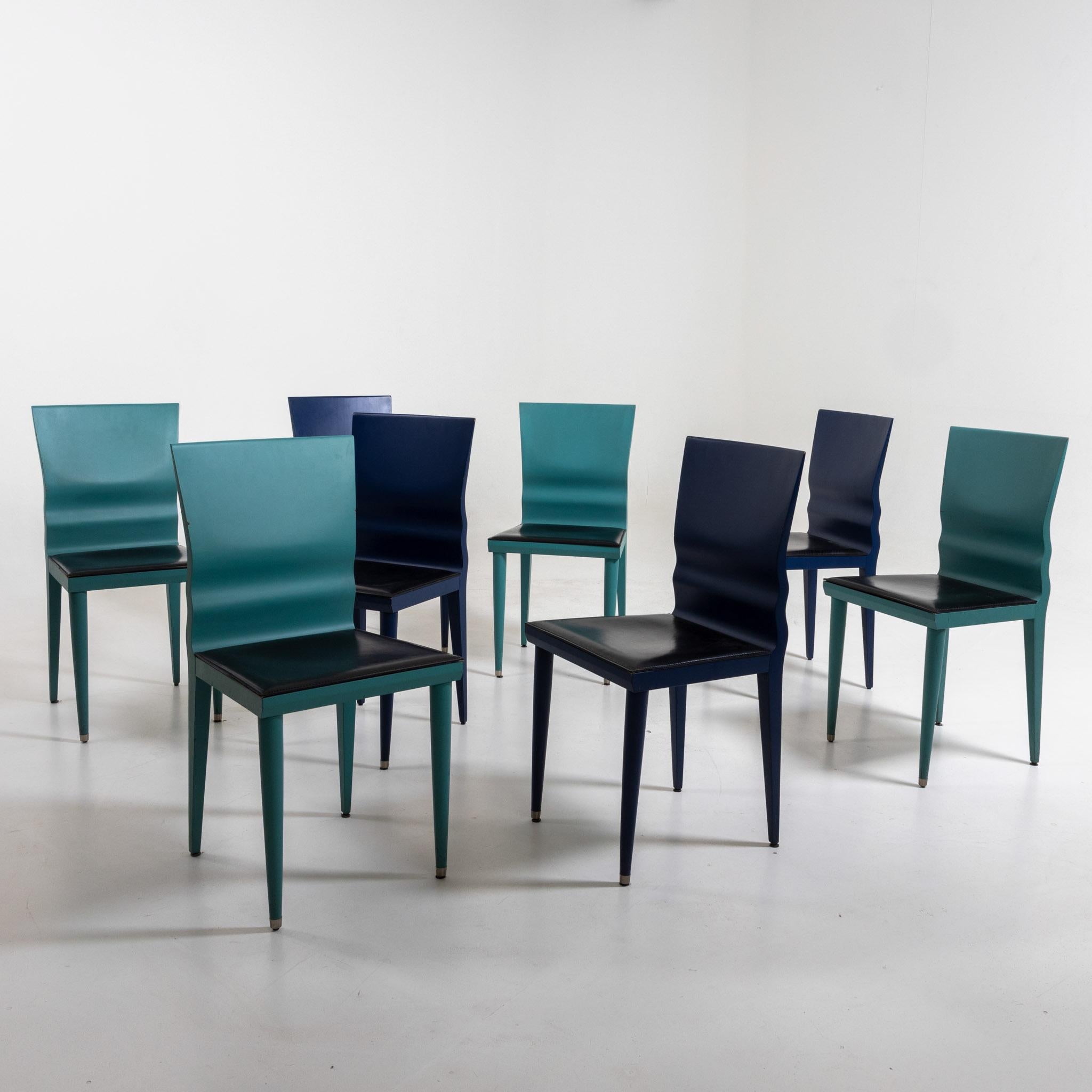 Set of eight Diva chairs, four each in blue and in turquoise. The backrest is trapezoidal and wavy in the lower part. The chairs are covered with a black leatherette. Perfectly restored condition.