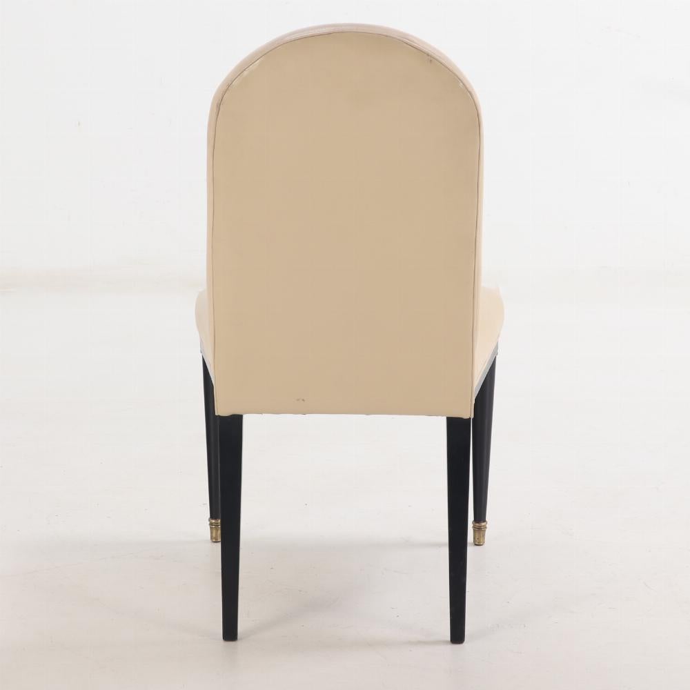 These elegant chairs feature arched backs and beautifully tapered circular front legs with gilt bronze capitals at the tops and caps on the feet. The square tapering back legs splay nicely. This set of bronze mounted side chairs / back stools are in