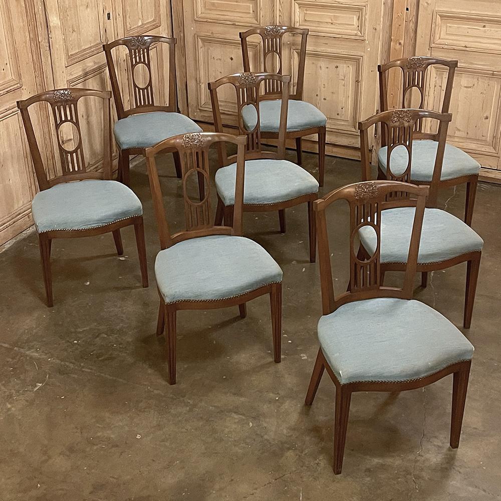 Set of 8 English Hepplewhite dining chairs are the ideal choice for a look that is slightly formal, yet easily adaptable to a more casual dining experience due to the tailored lines of the design. Subtly curved seat backs are defined by a gentle
