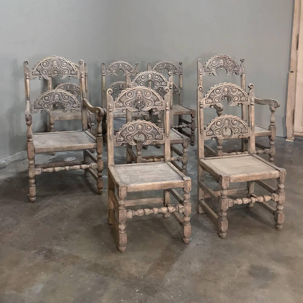 Set of eight English Renaissance stripped chairs, with two armchairs feature incredible detail on the seatbacks in the style of the Jacobeans, which contrasts with the plank seats designed for seat cushions, and the tailored turnings of the legs