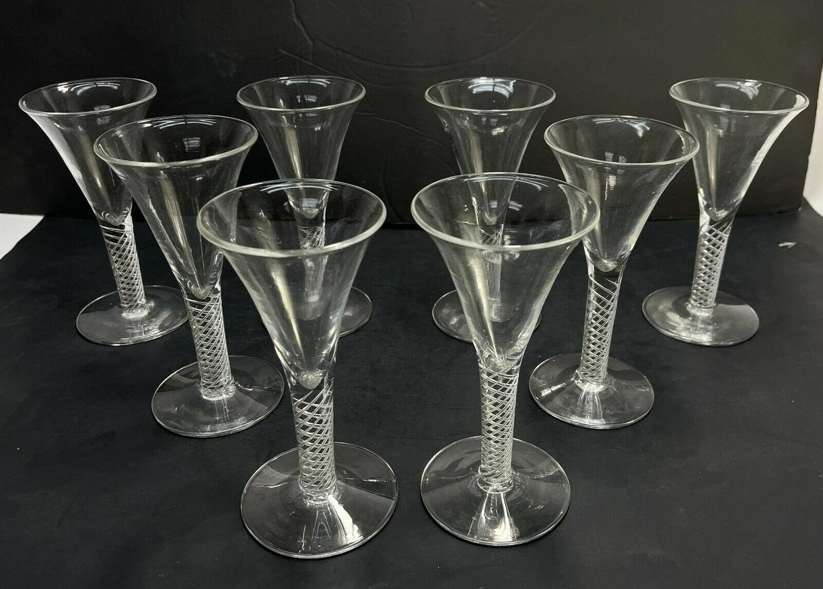 Set of 8 English Striation air twist stem wine goblets, 19th century or earlier

Rough pontils to the underside base.

Additional information:
Style: Victorian 
Material: Glass
Type: Wine Goblet 
Color: Clear
Lid Type: Twist 
Glassware