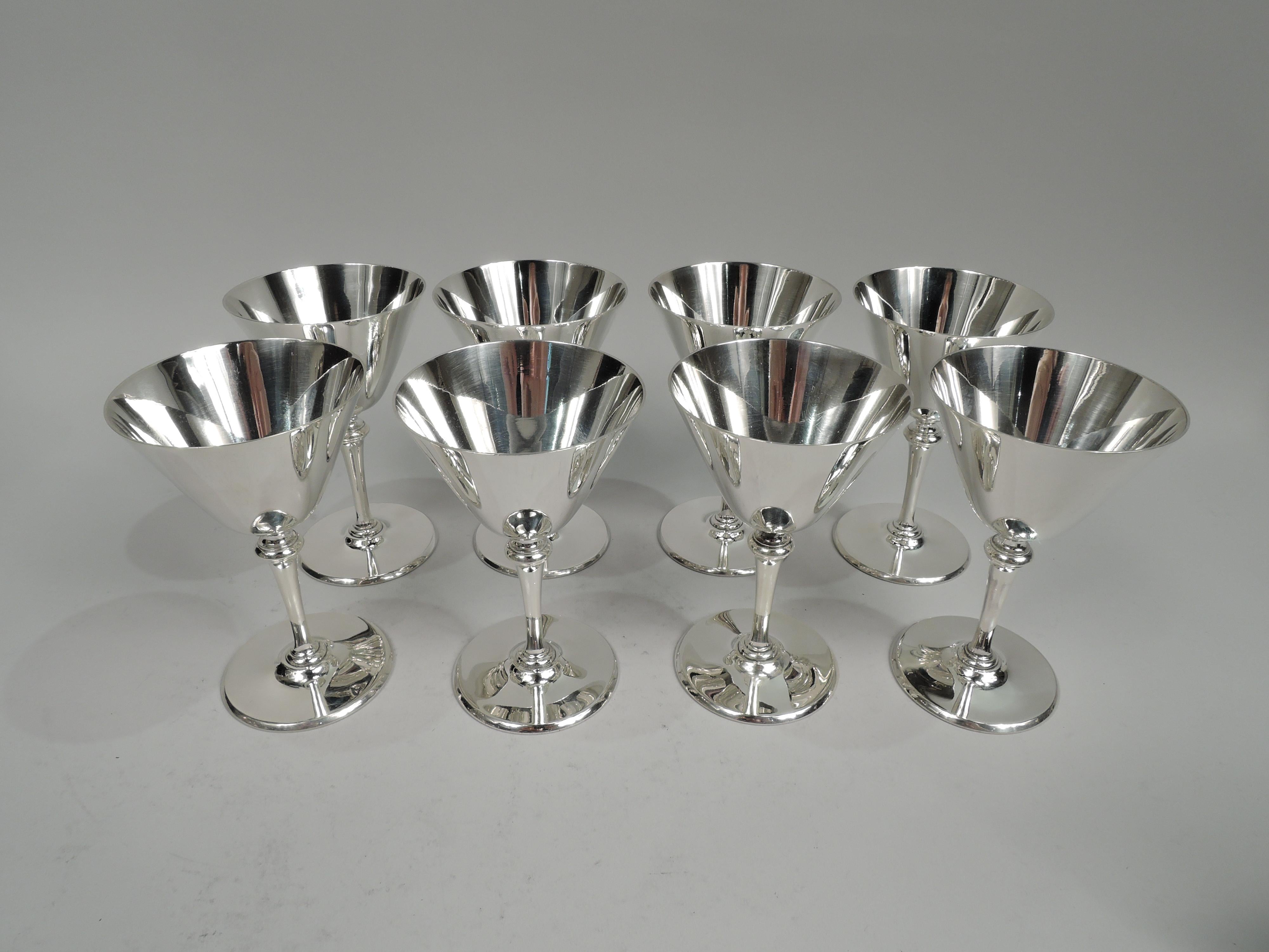 Set of 8 fabulous Art Deco sterling silver cocktail cups. Made by Tiffany & Co. in New York, ca 1922. Each: Conical bowl on tapering stem with stepped base on raised round foot. Fully marked including pattern no. 20037 (first produced in 1922),