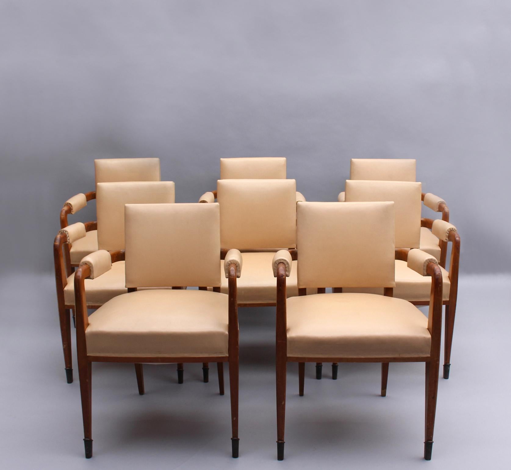 A set of 8 fine French Art Deco solid wood bridge armchairs with bronze sabots.