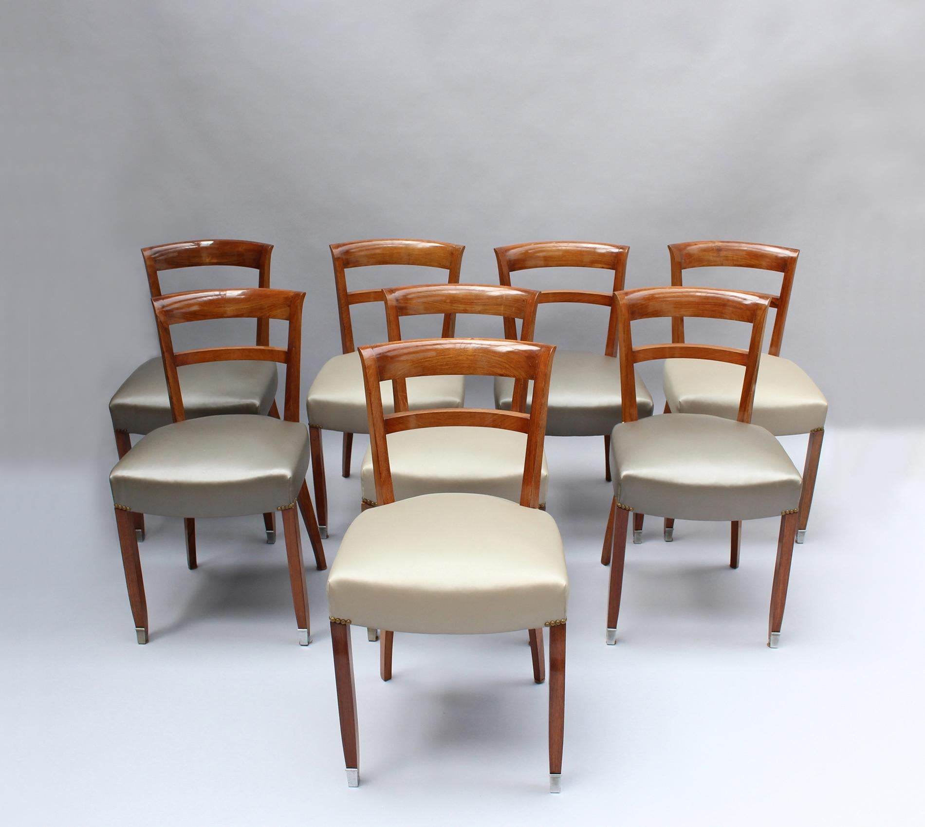 Jules Leleu - A set of eight fine French Art Deco palisander dining chairs with nickeled sabots.
Some of them are stamped.
 