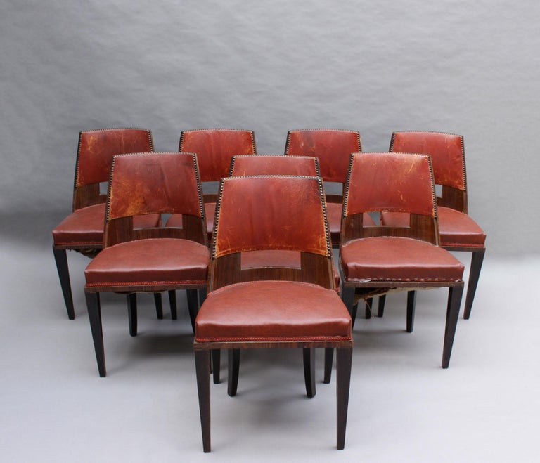 René Joubert and Philippe Petit for D.I.M (Decoration Interieure Moderne). - A set of height fine French 1930s gondola dining chairs in palisander and stained solid wood.
Documented, and 3 of the chairs have visible tags.