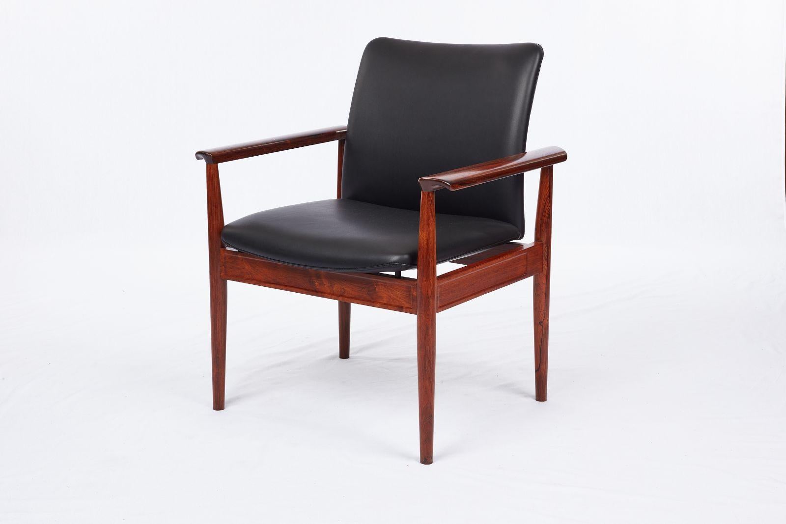 Set of 8 Finn Juhl Rosewood Diplomat armchairs Produced by France & son.