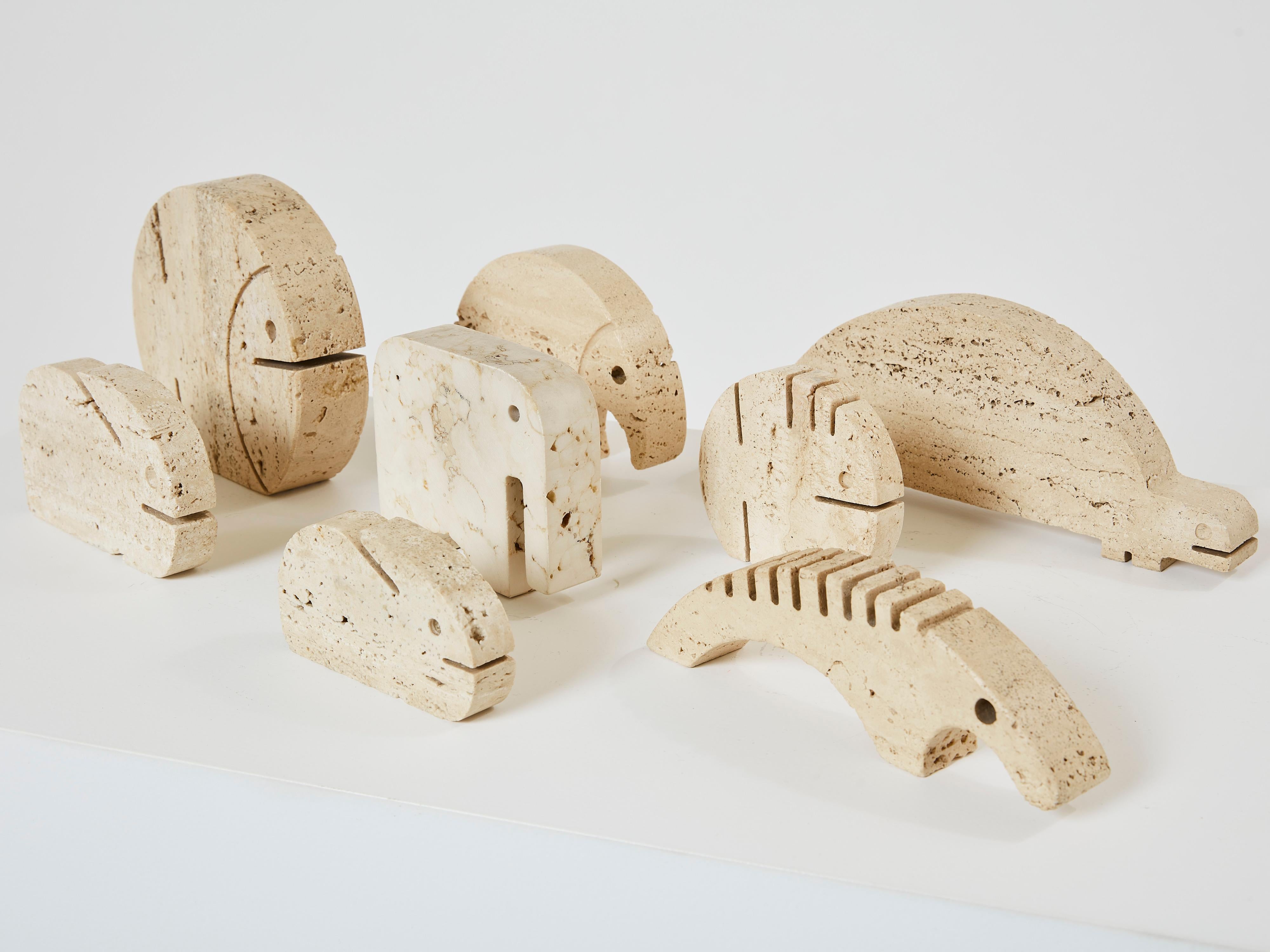 This is a very nice set of eight animal sculptures designed by Fratelli Mannelli in Italy in the early 1970s. Each animal sculpture is handmade by sculpting travertine blocks. The set includes one elephant, one fish, two rabbits, one hedgehog, one