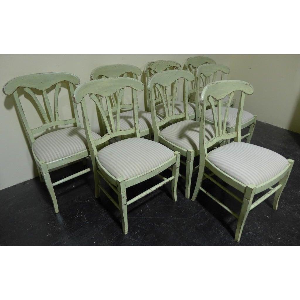 Set of 8 French Country Dining Chairs. Chairs have painted Old World finish and upholstered seats. Curved top rail with three vertical splat design. Made in Italy by Buying and Design, Florence, Italy. Some discoloration on upholstery.