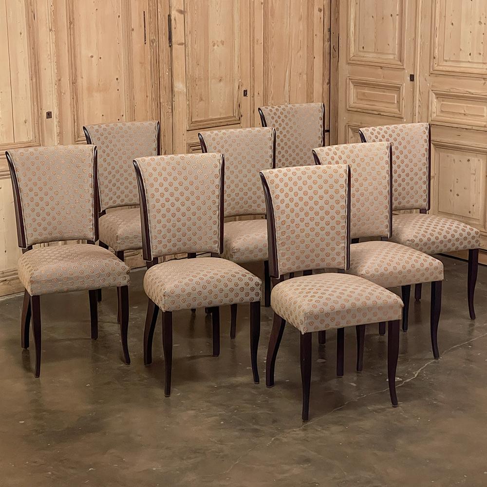 Set of 8 French directoire style mid-century mahogany dining chairs are perfect for providing tailored, stylish comfort to your dining experience! Generous seats are taller than normal, and seatbacks are wonderfully contoured and flared to envelop