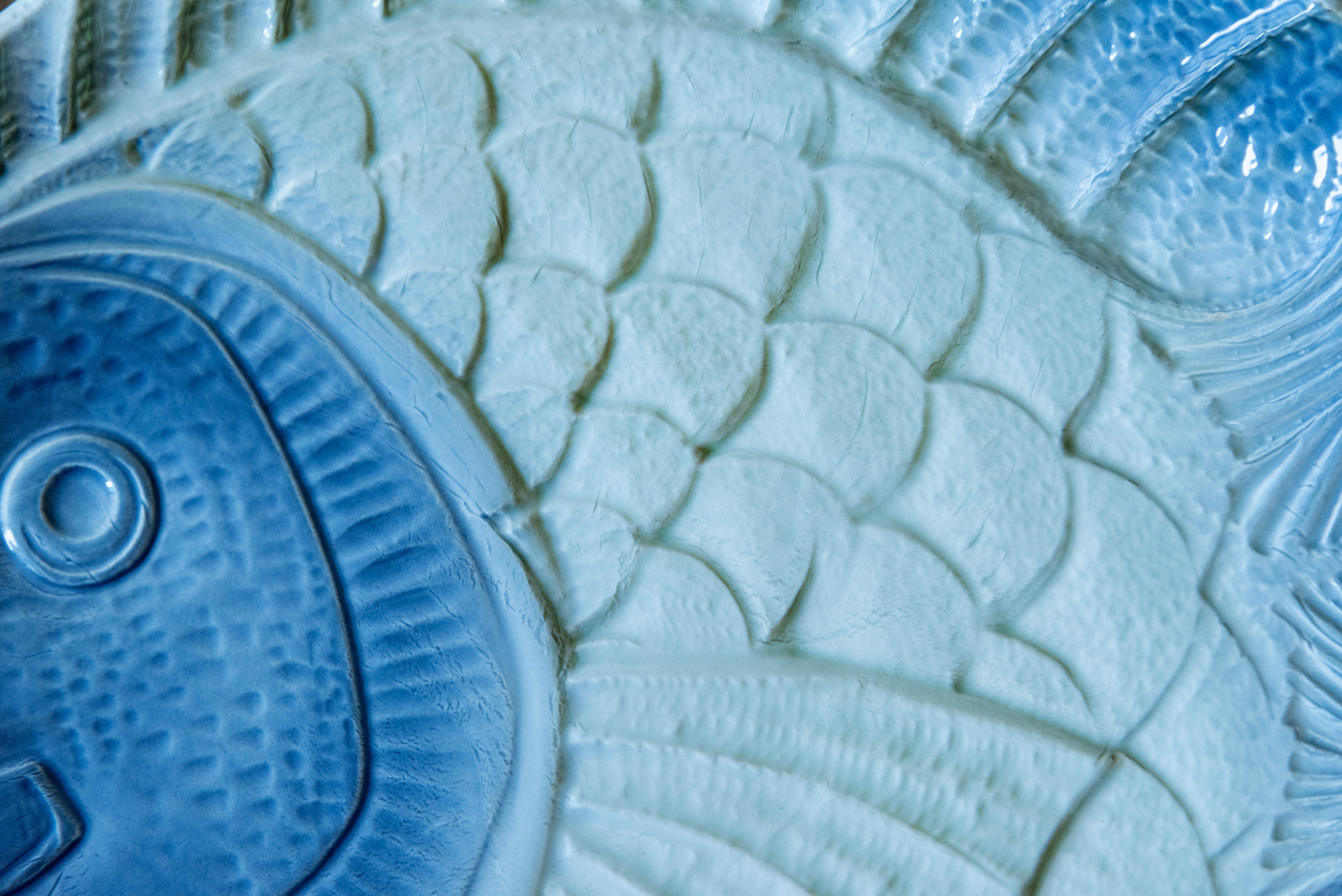 Elevate your dining experience with this stunning Set of 8 French Fish Plates, each signed with the elegant initials AR LR. Crafted with exquisite artistry, these plates boast a captivating combination of white, blue, and green slurry or majolica,
