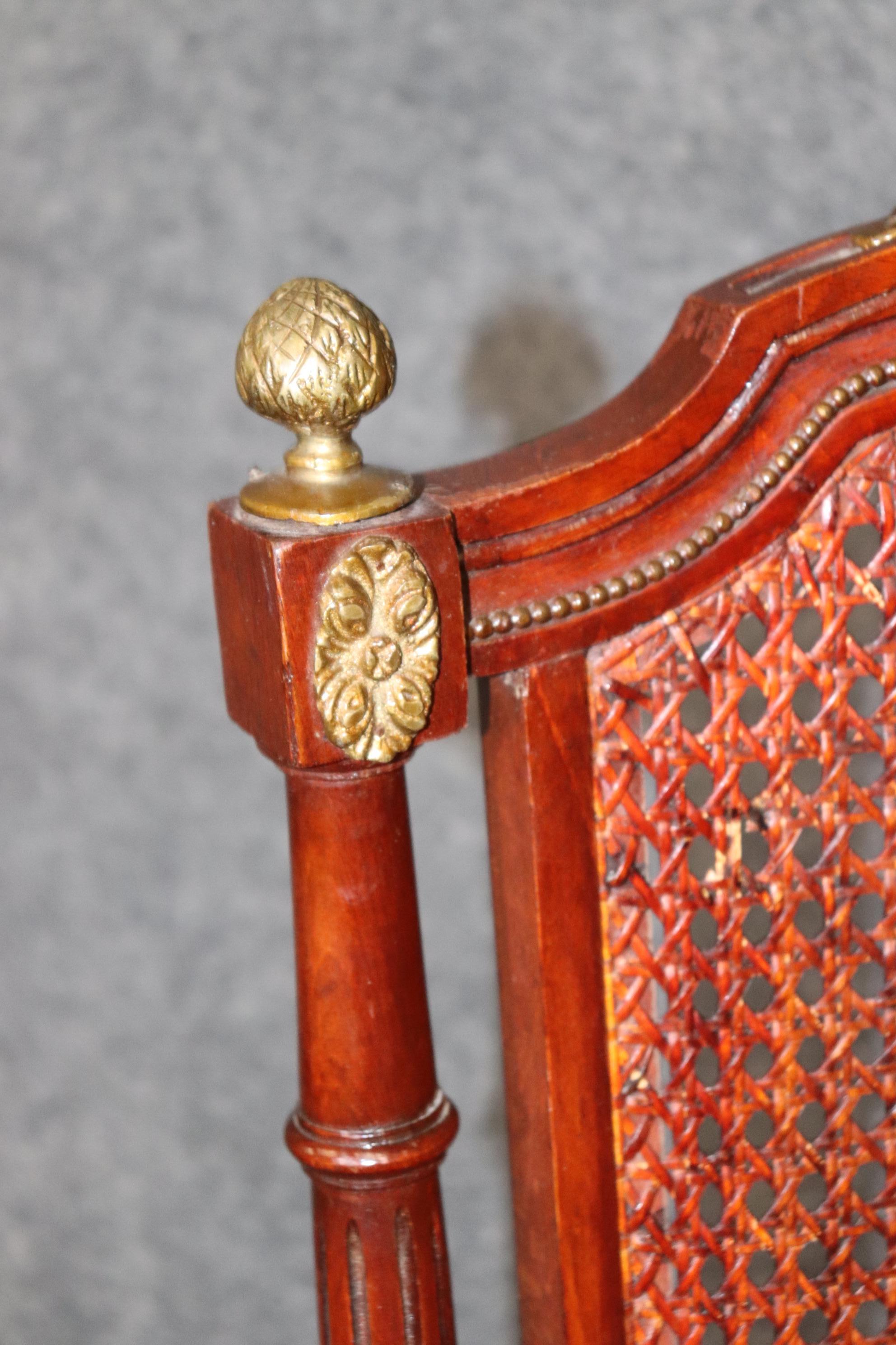 Mid-20th Century Set of 8 French Louis XVI Style Mahogany Cane Back Dining Chairs with Ormolu For Sale