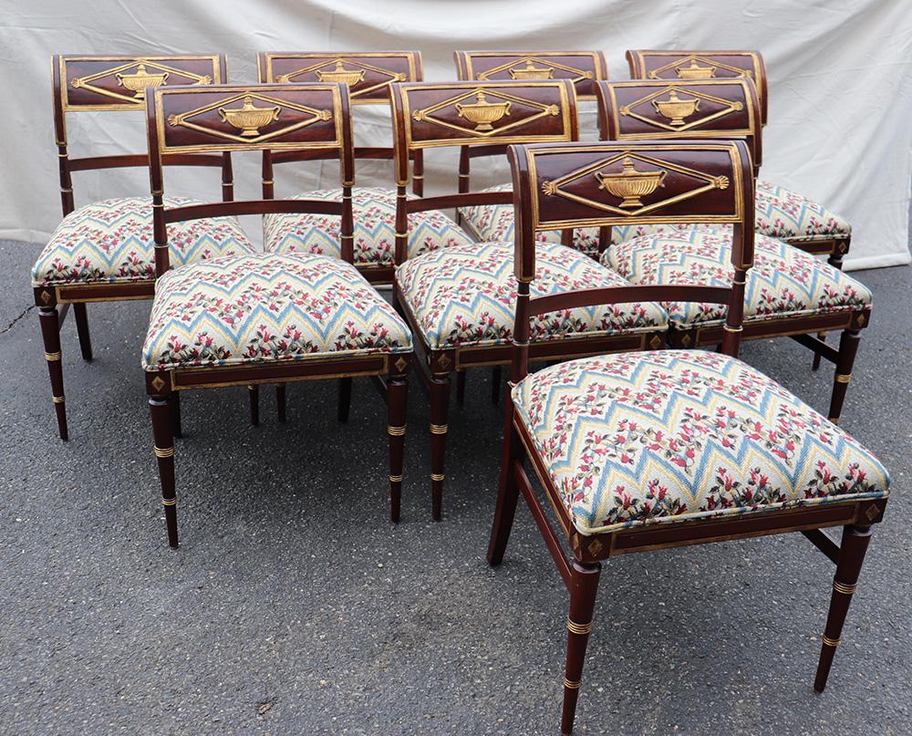 Set of 8 French mahogany Directoire style dining side chairs with gilded accents.