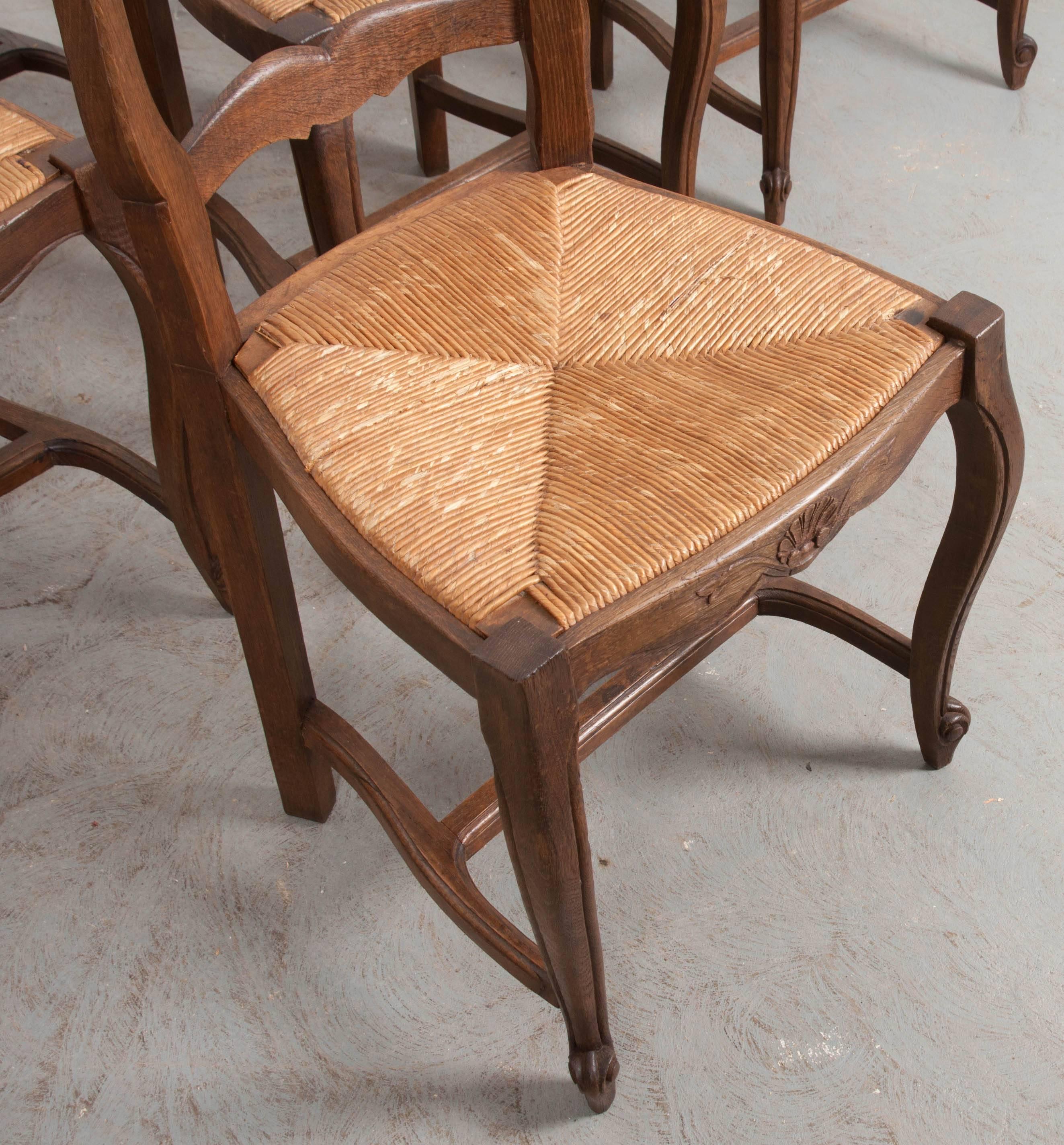 French Provincial Set of Eight French Oak Ladder Back Chairs with Rush Seats
