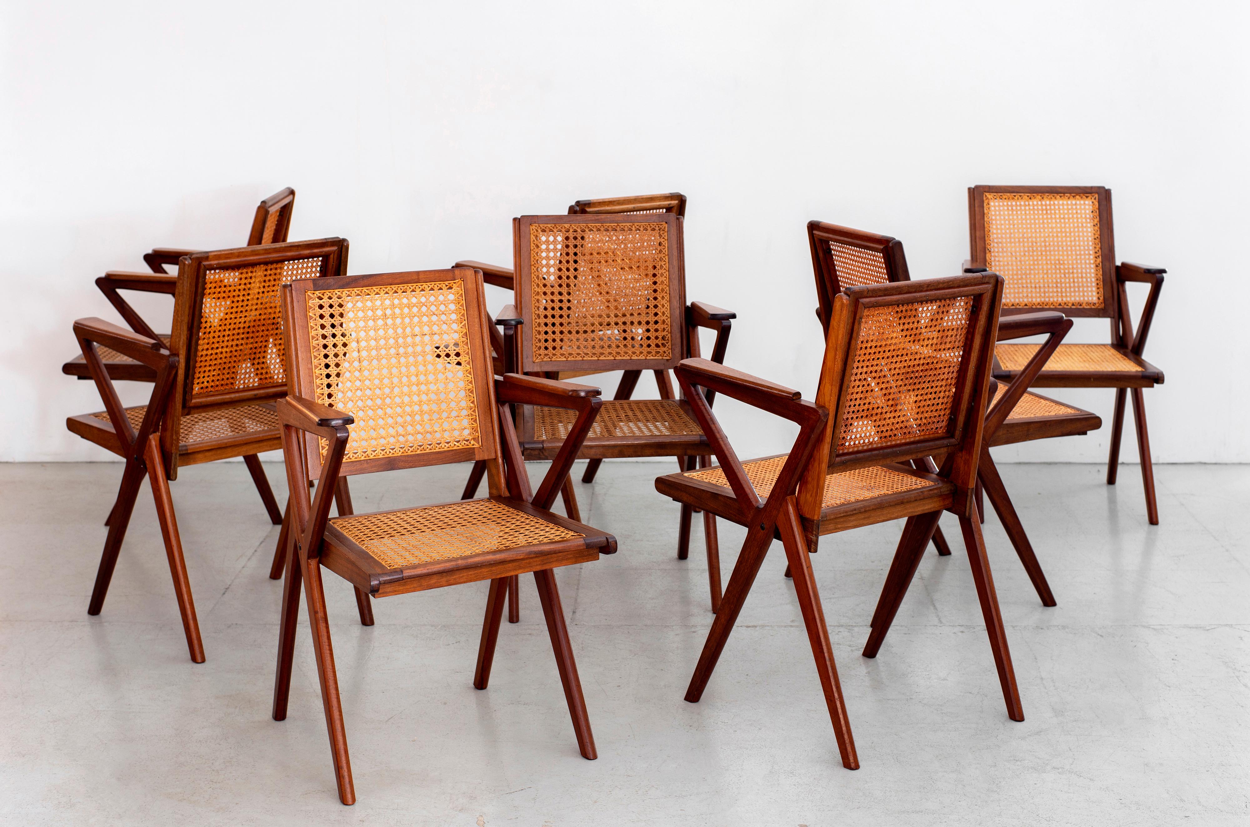 Great set of 8 teak and caned dining room chairs, French, circa 1950s
In the style of Pierre Jeanneret with fantastic angles and design.
Warm wood patina, restored.